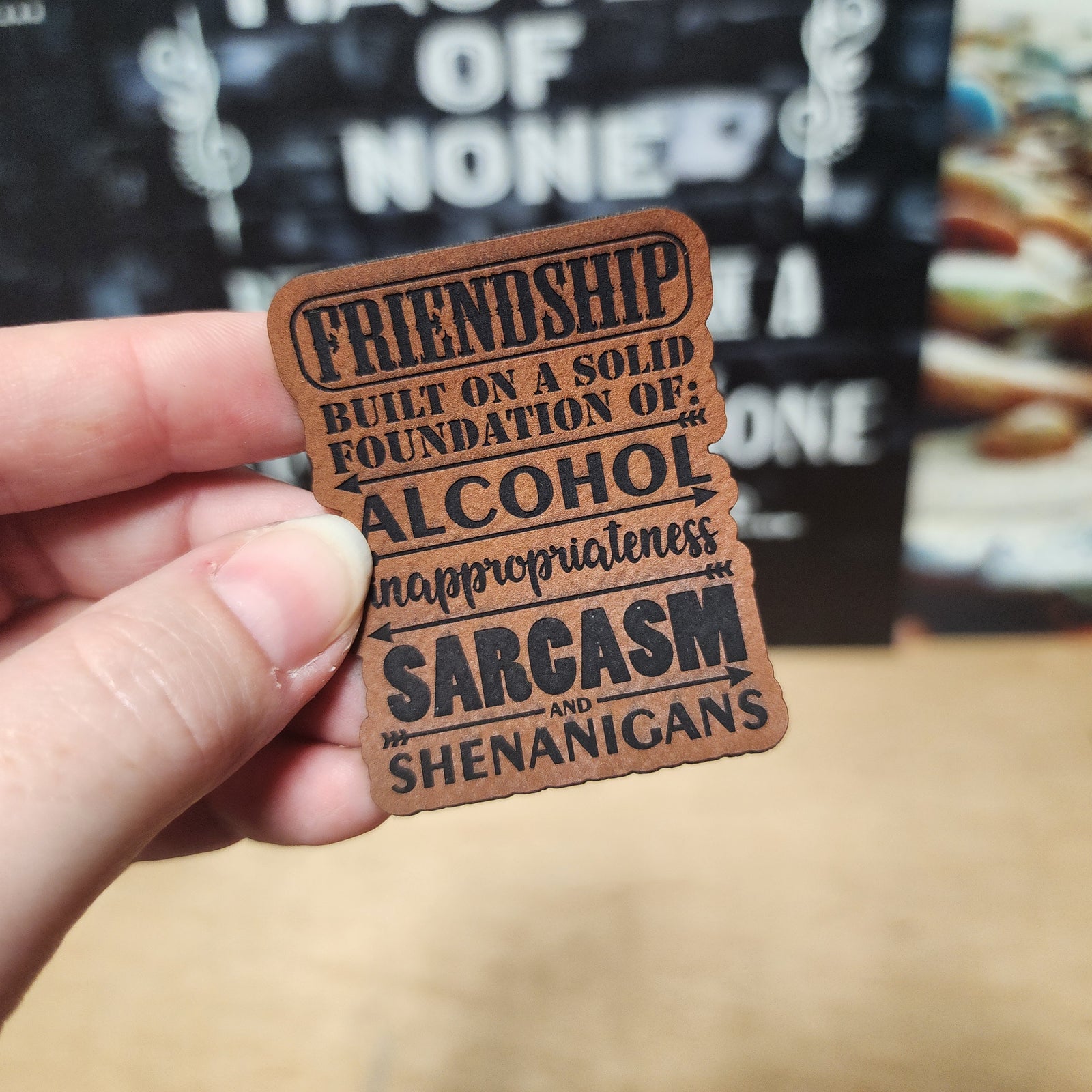 Unique leatherette hat patch with humorous friendship quote about alcohol, sarcasm and shenanigans.