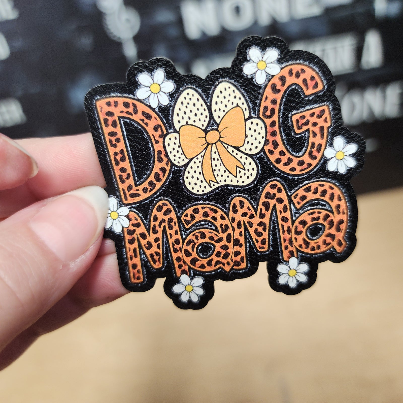 Dog Mama leatherette patch with leopard print lettering and floral accents, perfect for pet lovers and accessories.