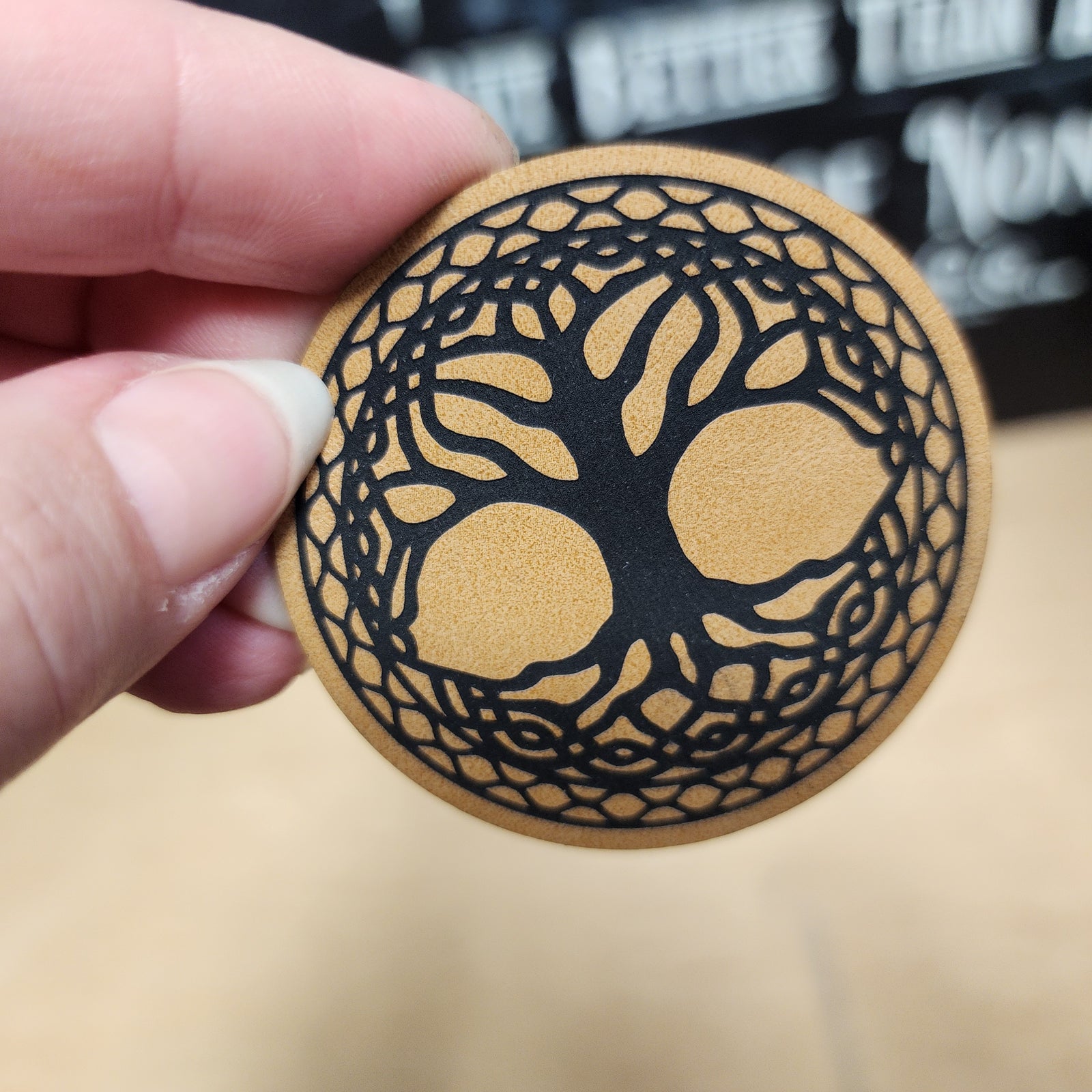 Leatherette hat patch featuring a black tree design, perfect for nature lovers and outdoor enthusiasts.