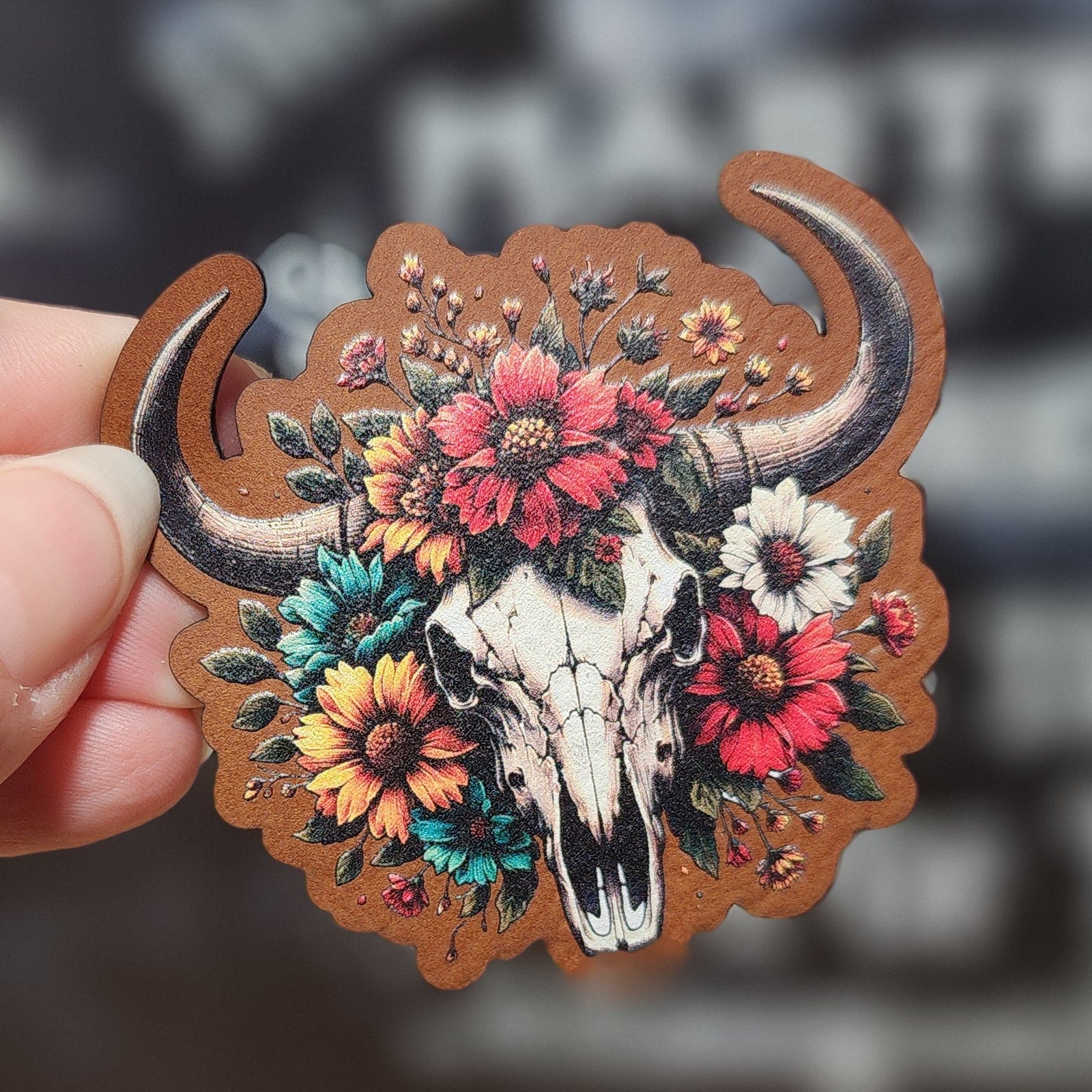 Floral skull leatherette hat patch for cowboy and western-themed apparel, perfect for adding unique style.