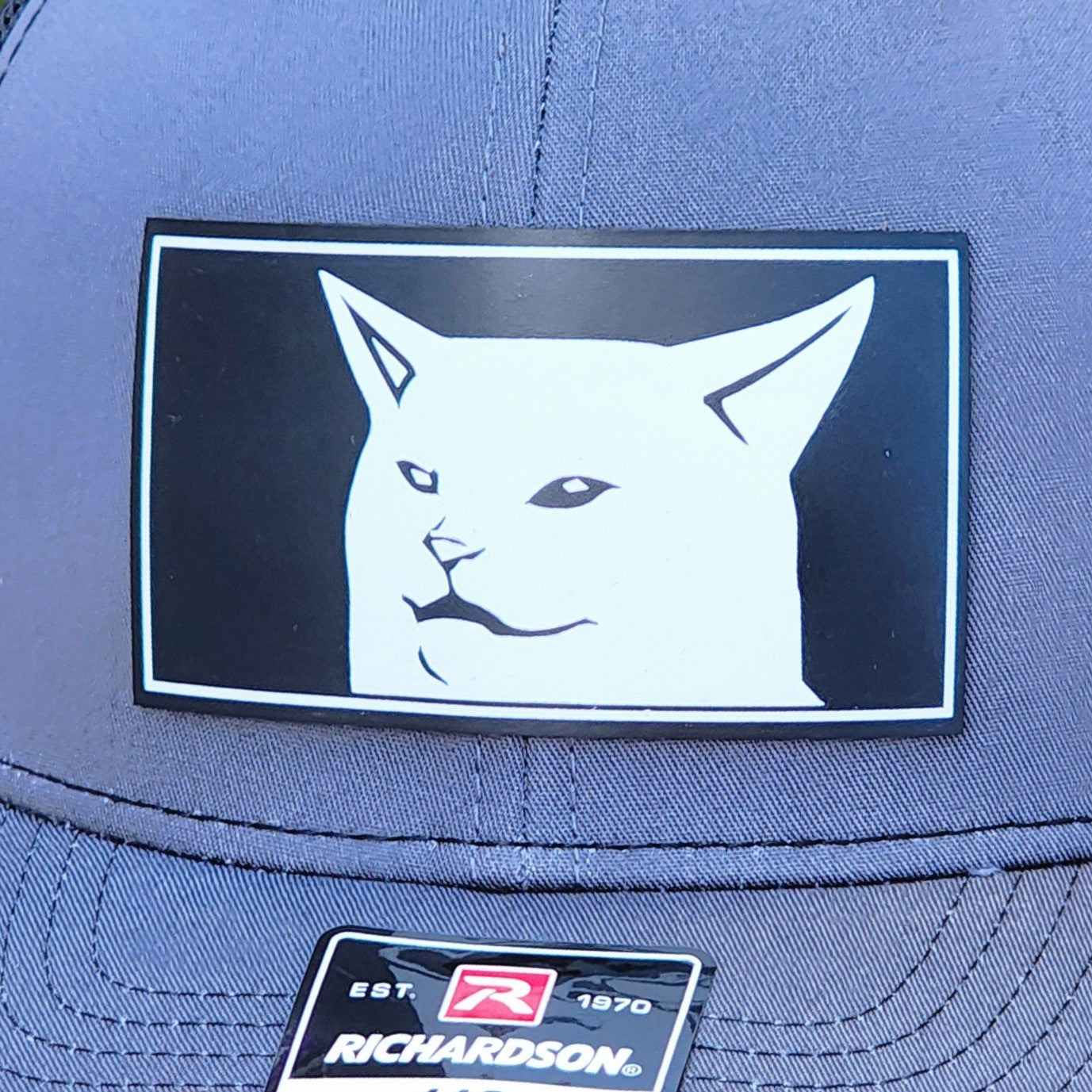 Cat-themed leatherette hat patch featuring a striking graphic design of a white cat, perfect for animal lovers.