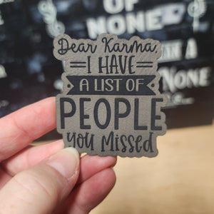Humorous leatherette hat patch that says 'Dear Karma, I have a list of people you missed,' perfect for quirky gifts.