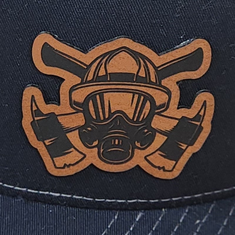 Firefighter leatherette hat patch featuring a gas mask and crossed axes, perfect for fire-themed cap collections.