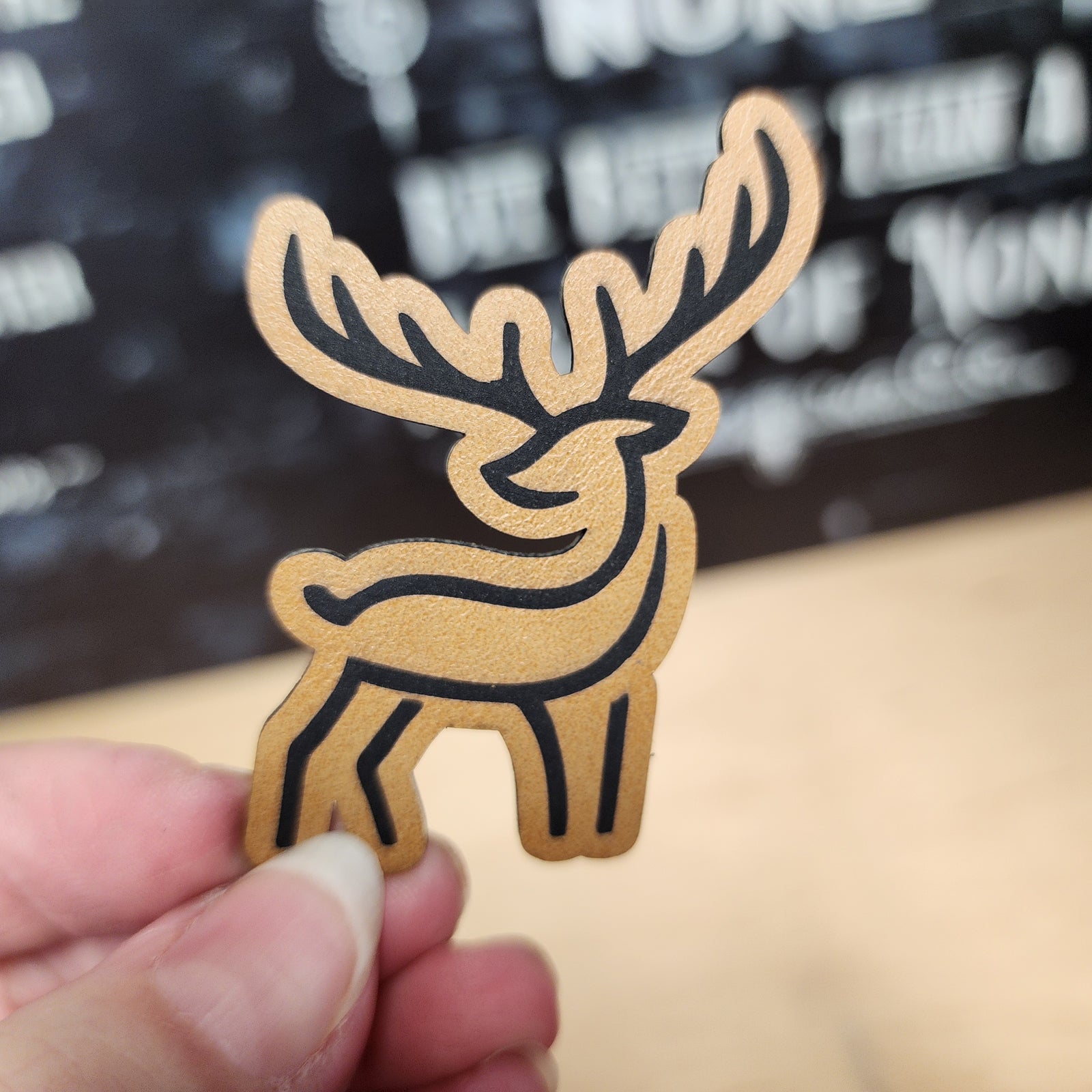 Unique leatherette hat patch featuring a stylish deer design, perfect for outdoor enthusiasts and fashion lovers.