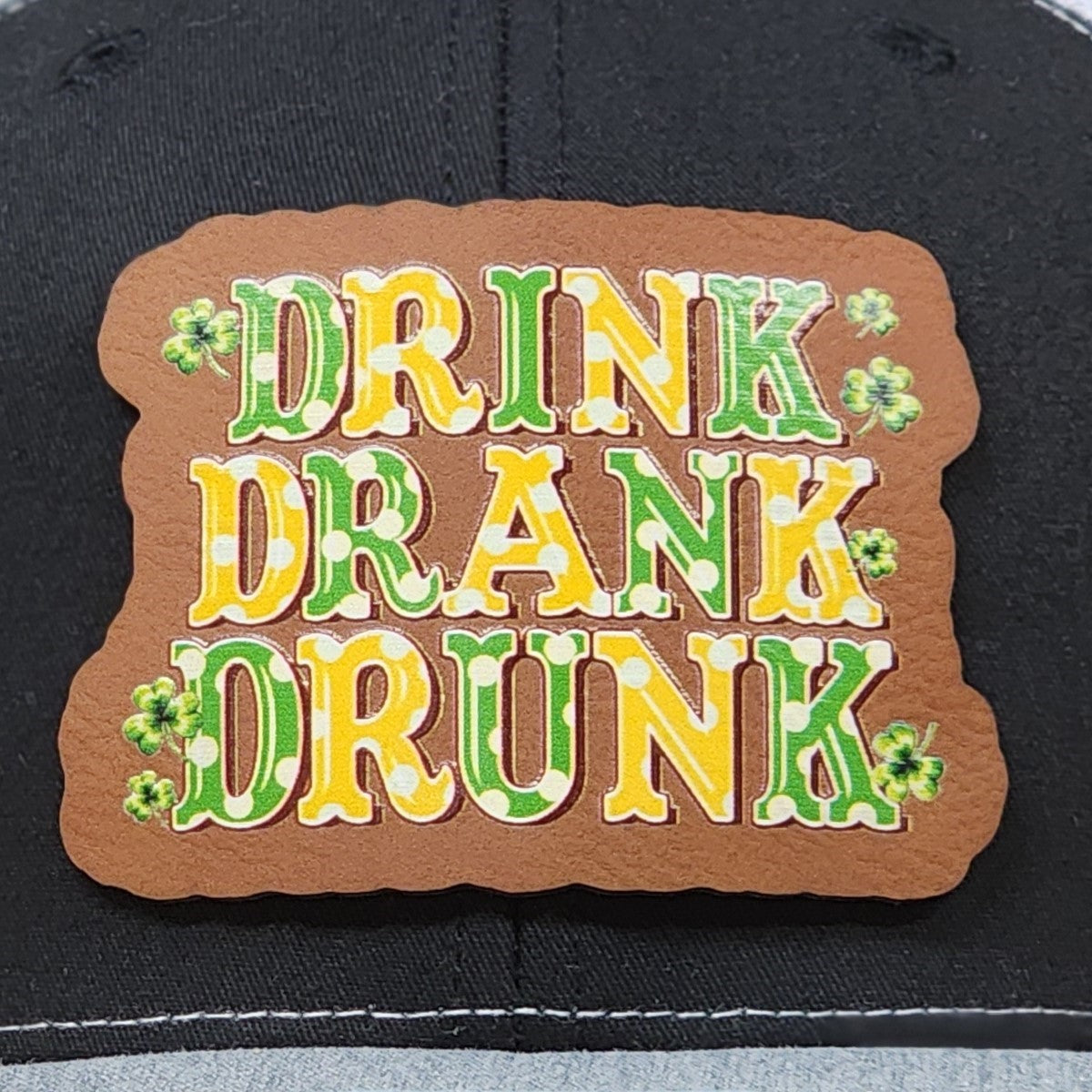 St. Patrick's Day leatherette hat patch with 'Drink Drank Drunk' design for festive celebrations.