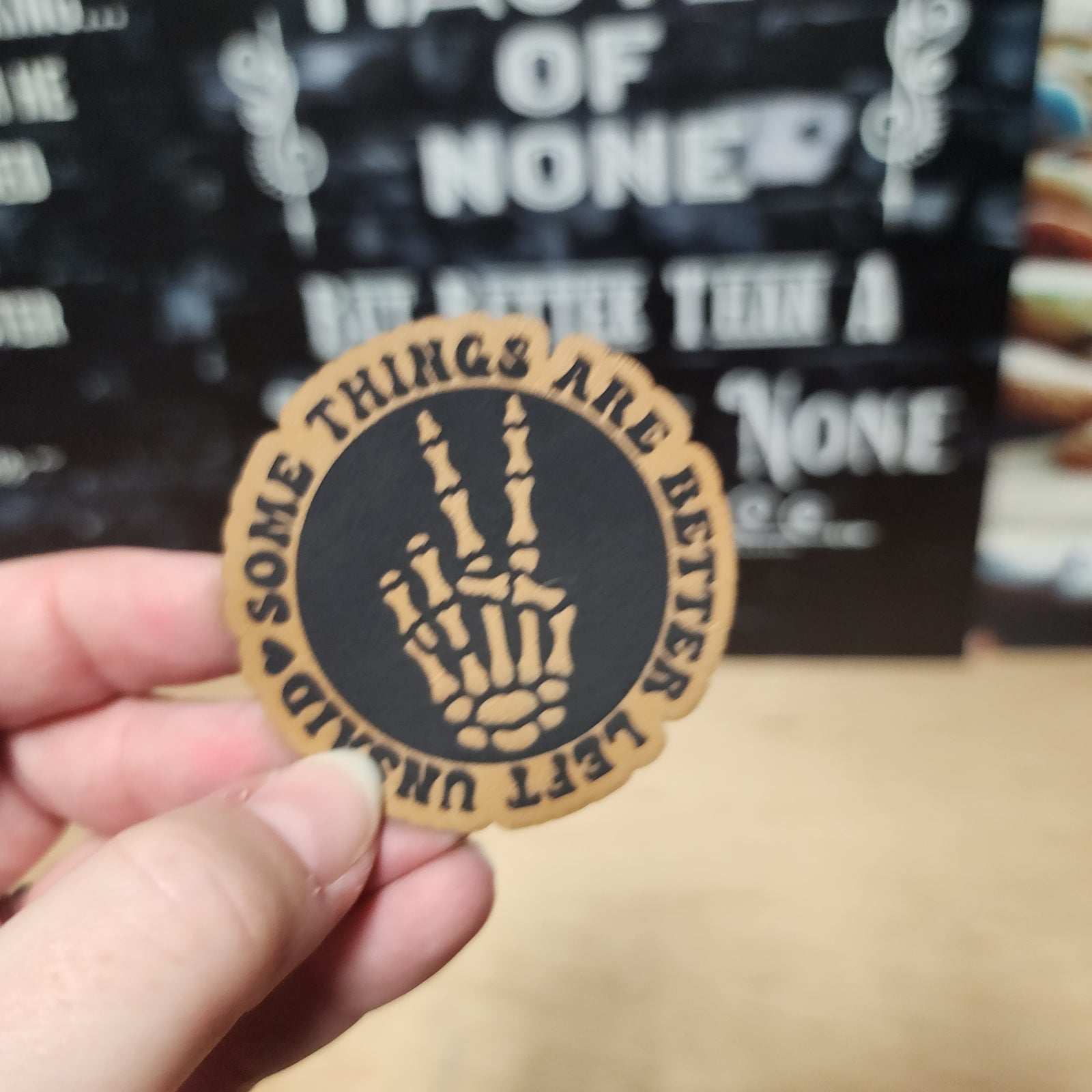 Unique leatherette hat patch with skeleton hand design, perfect for Halloween and gothic fashion enthusiasts.