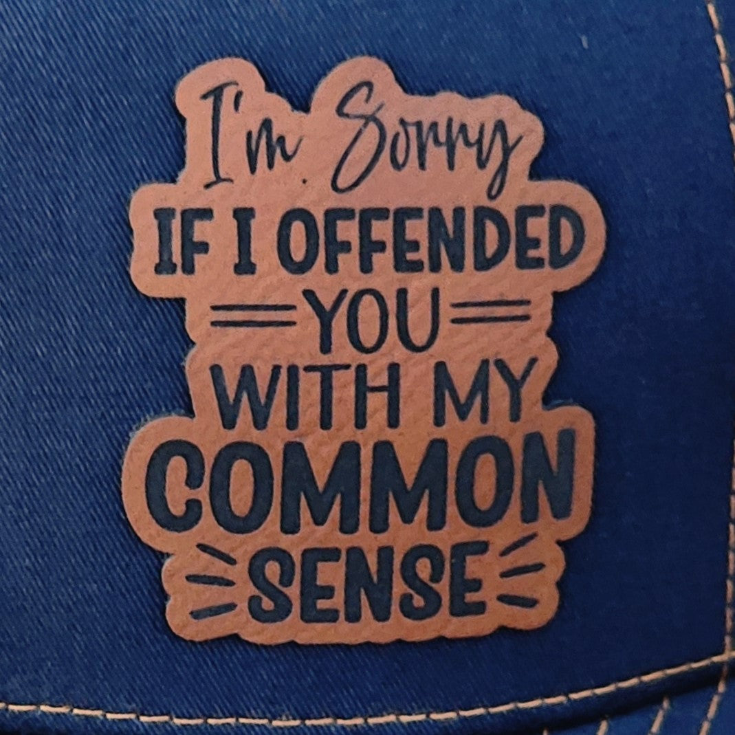 Funny leatherette hat patch saying 'I'm Sorry If I Offended You With My Common Sense' for humorous baseball caps.