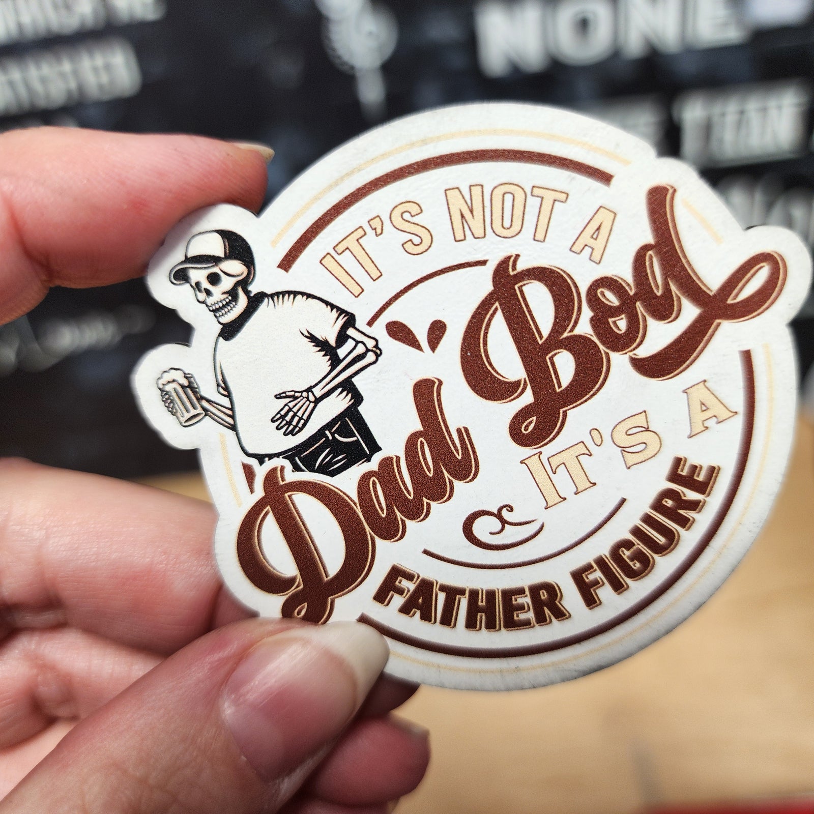Funny Dad Bod leatherette hat patch, featuring skeleton graphic and catchy 'Father Figure' quote for dad-themed gifts.