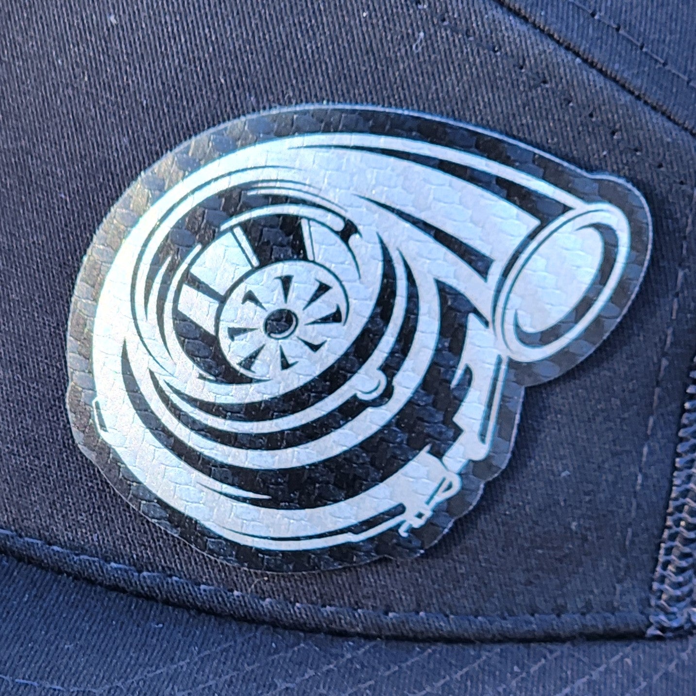 Turbocharger leatherette hat patch for car enthusiasts, perfect for automotive and racing gear collections.