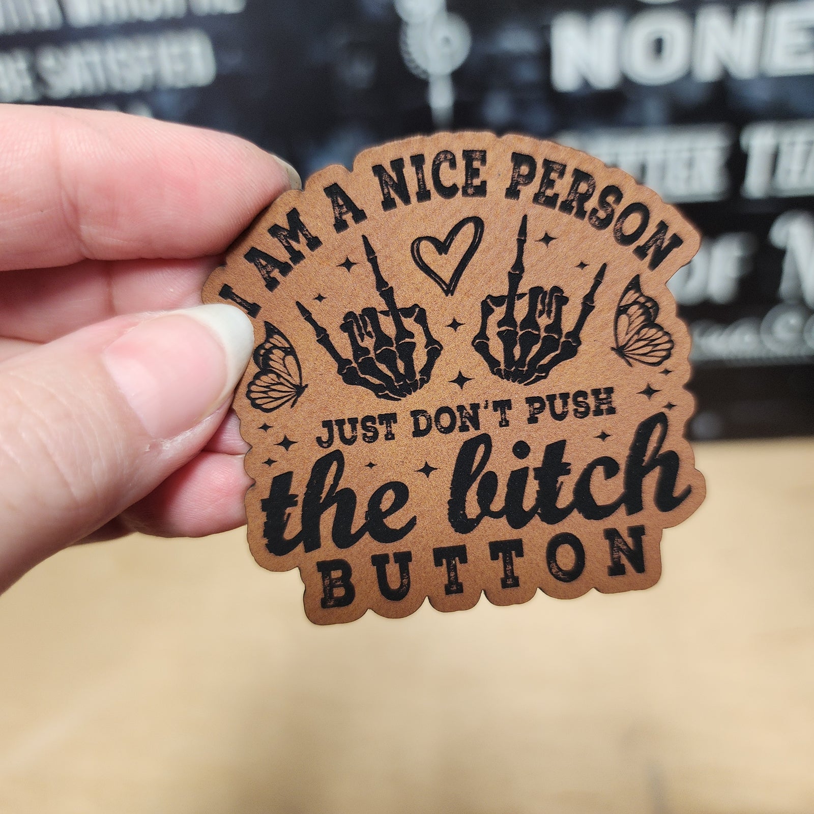 Leatherette hat patch with a message: 'I am a nice person, just don't push the bitch button' for edgy style.