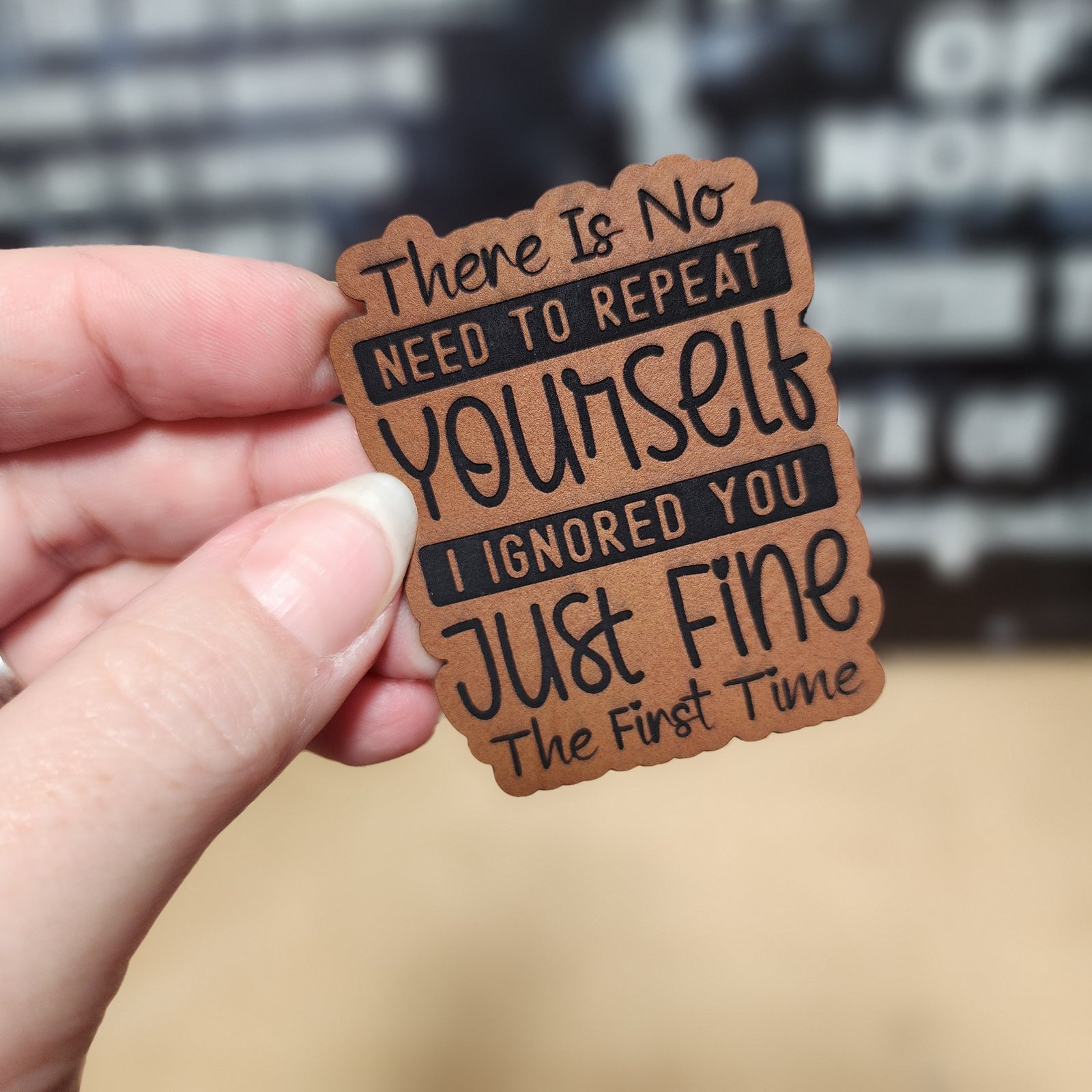 Funny leatherette hat patch with text: 'There Is No Need To Repeat Yourself, I Ignored You Just Fine The First Time'.
