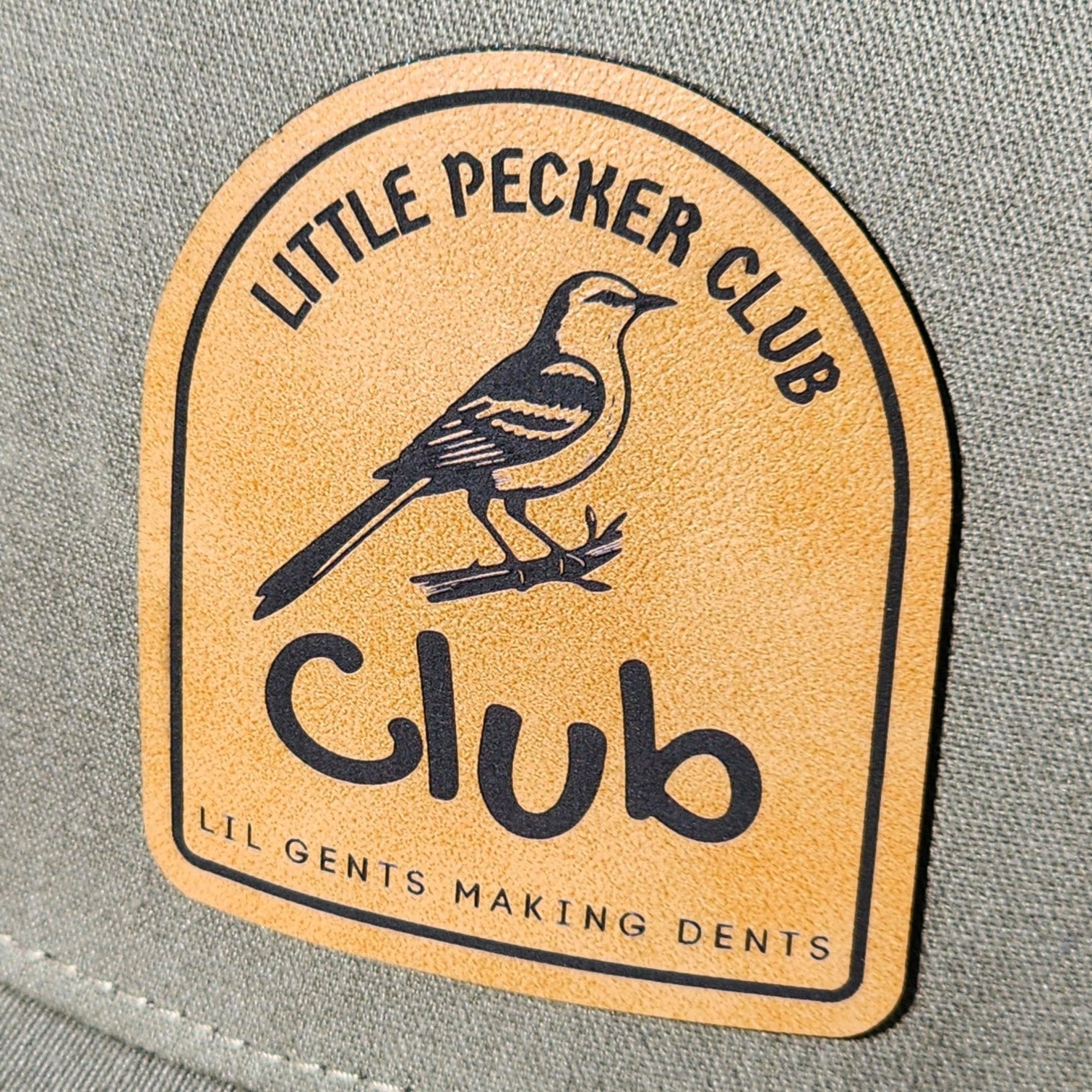 Little Pecker Club leatherette hat patch with bird design, perfect for unique and trendy headwear.