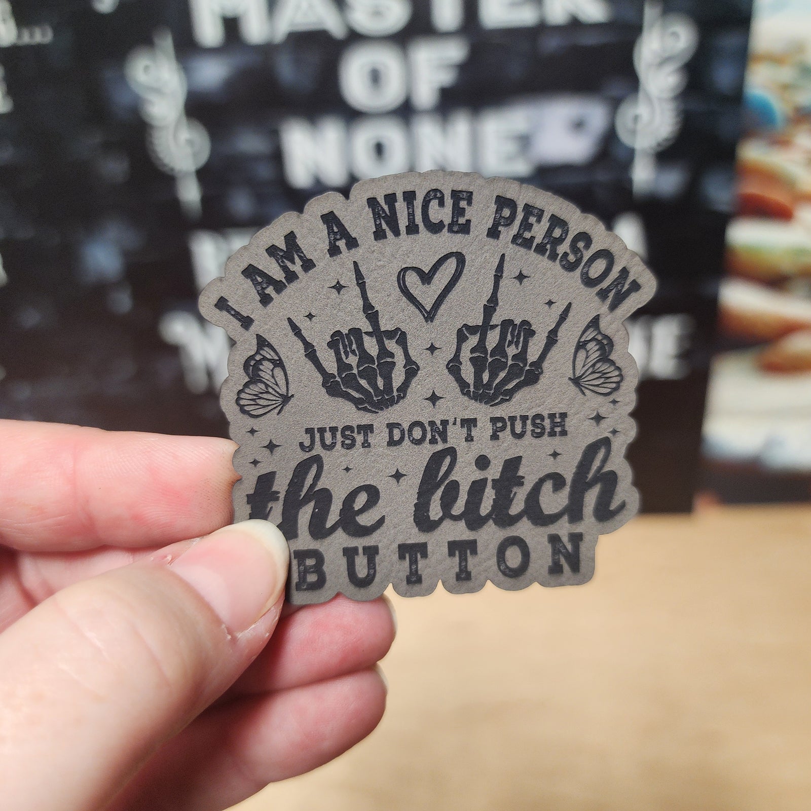 Leatherette hat patch with quirky text: 'I am a nice person, just don’t push the bitch button.'