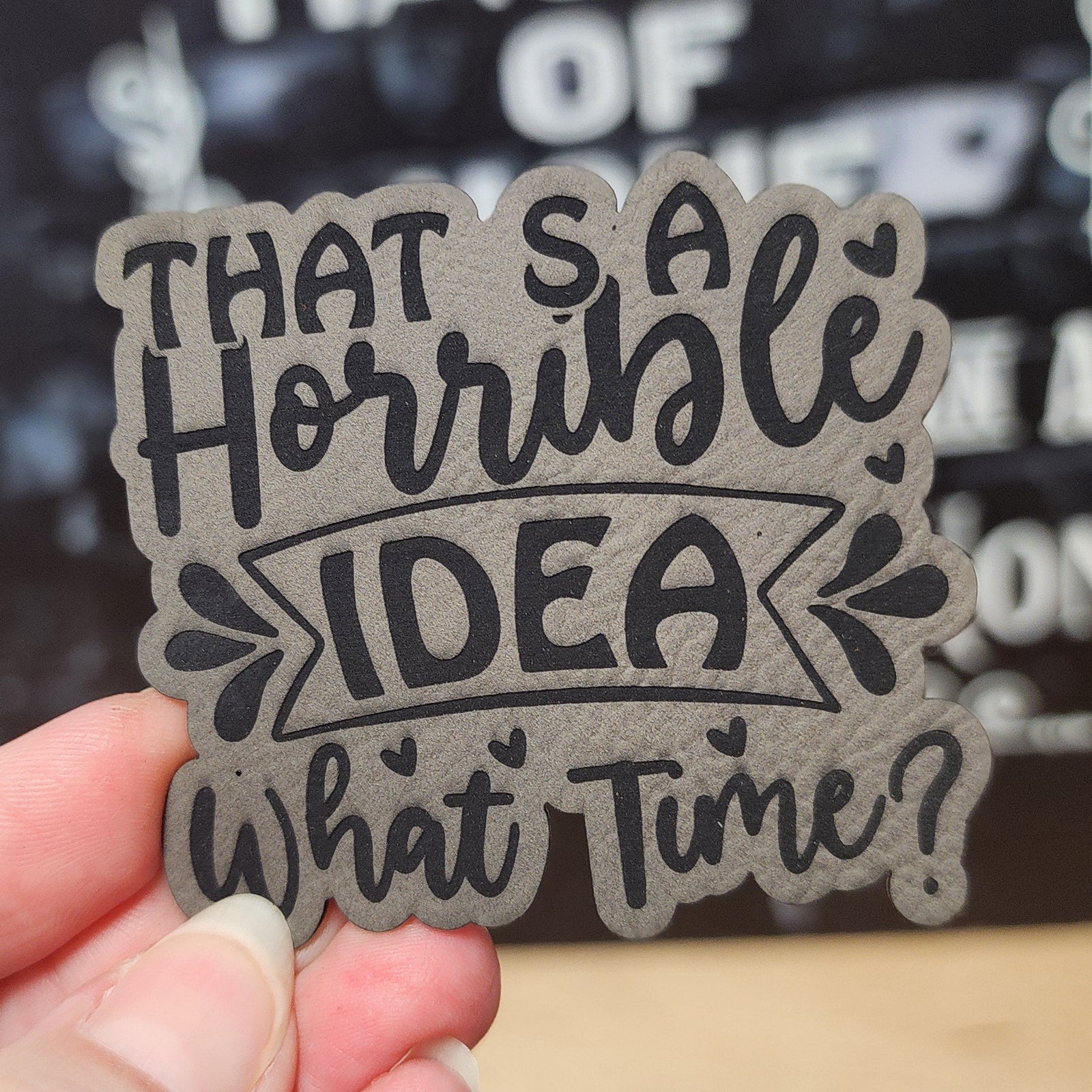 Funny leatherette hat patch saying 'That's a horrible idea, what time?' perfect for quirky hat collections.