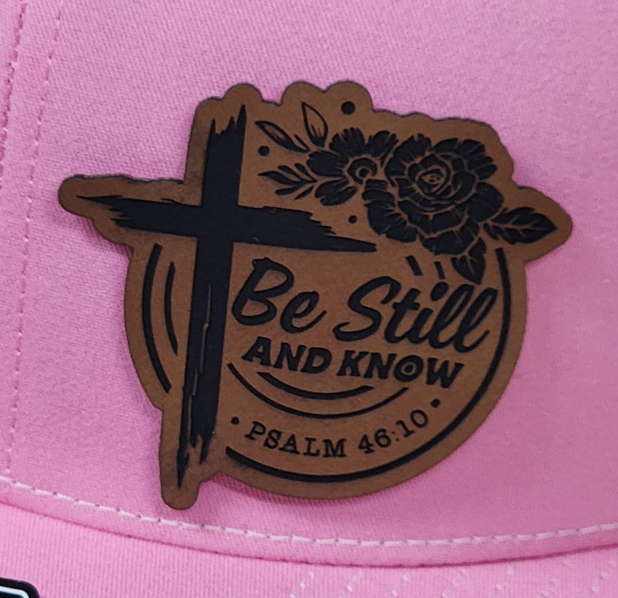 Faith-based leatherette hat patch with cross design, 'Be Still and Know', Psalm 46:10 for spiritual collection.