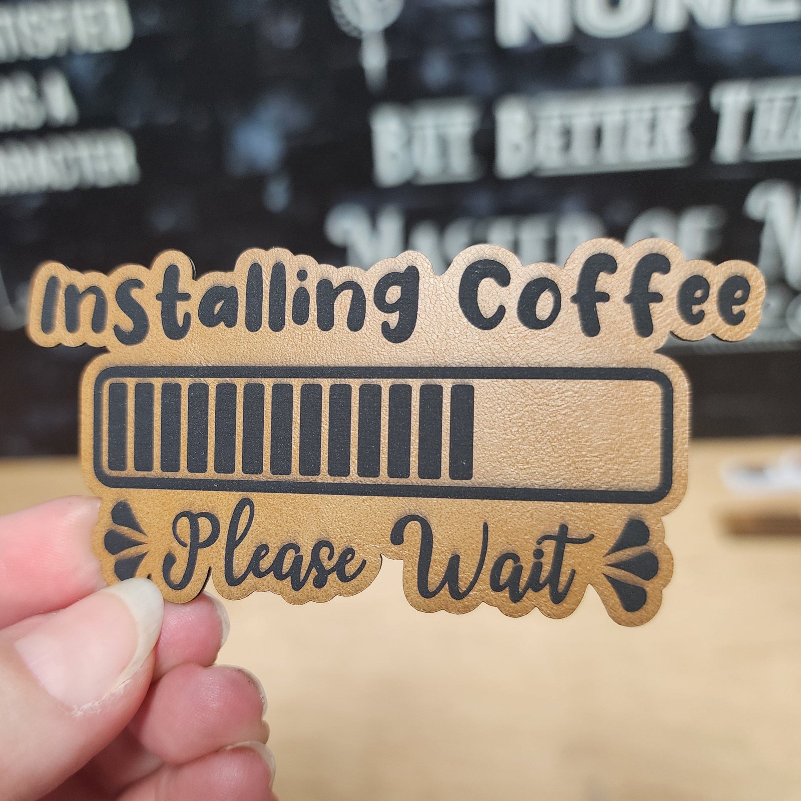 Installing Coffee leatherette hat patch, humorous coffee lover decor, great for caps and personalized gifts.