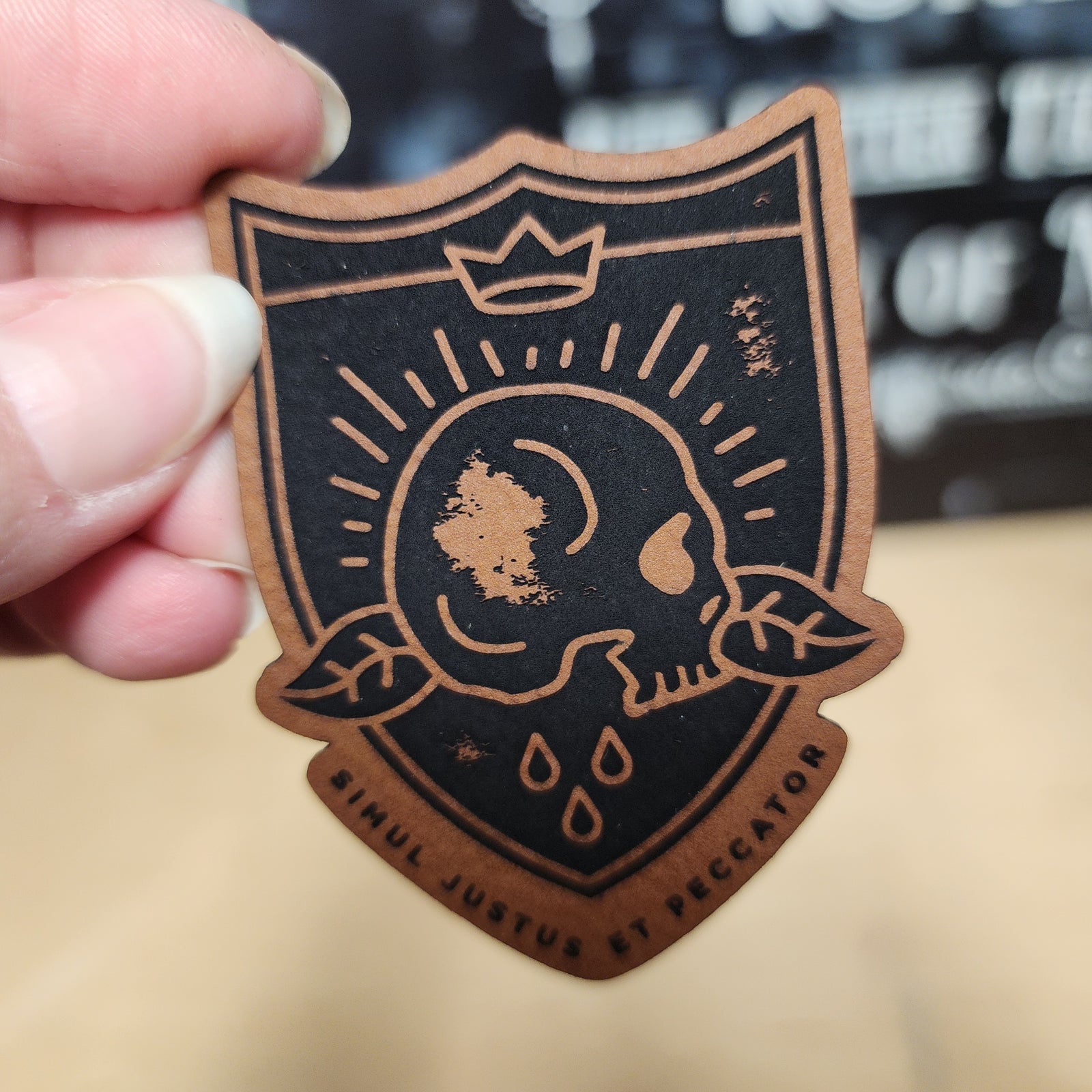 Leatherette skull design hat patch featuring vintage style with crown, perfect for hats and jackets.