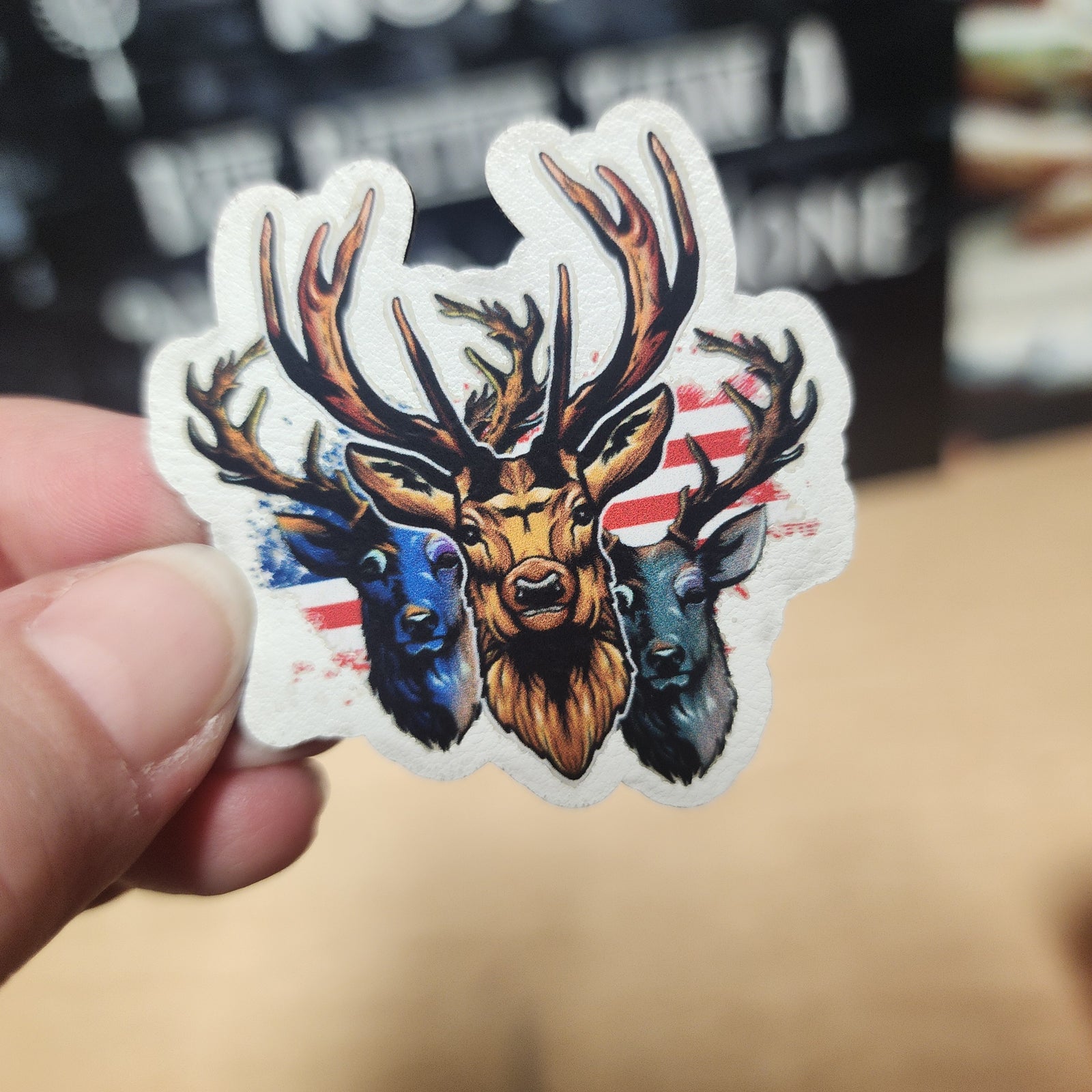 USA flag deer head leatherette patch, vibrant three deer design, perfect for outdoor enthusiasts and hunting fans.