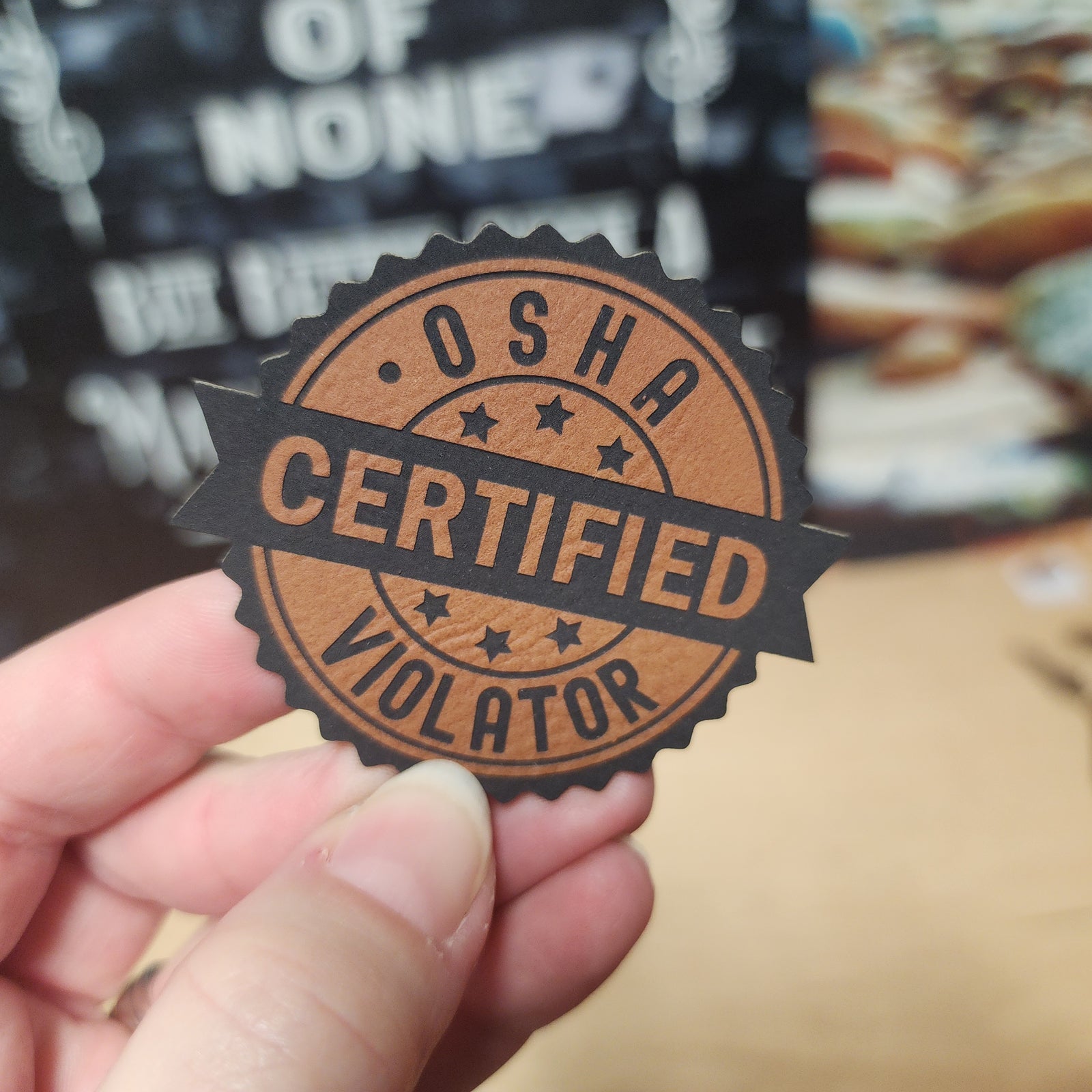 OSHA Certified Violator leatherette hat patch, humorous workplace accessory for safety-themed apparel.