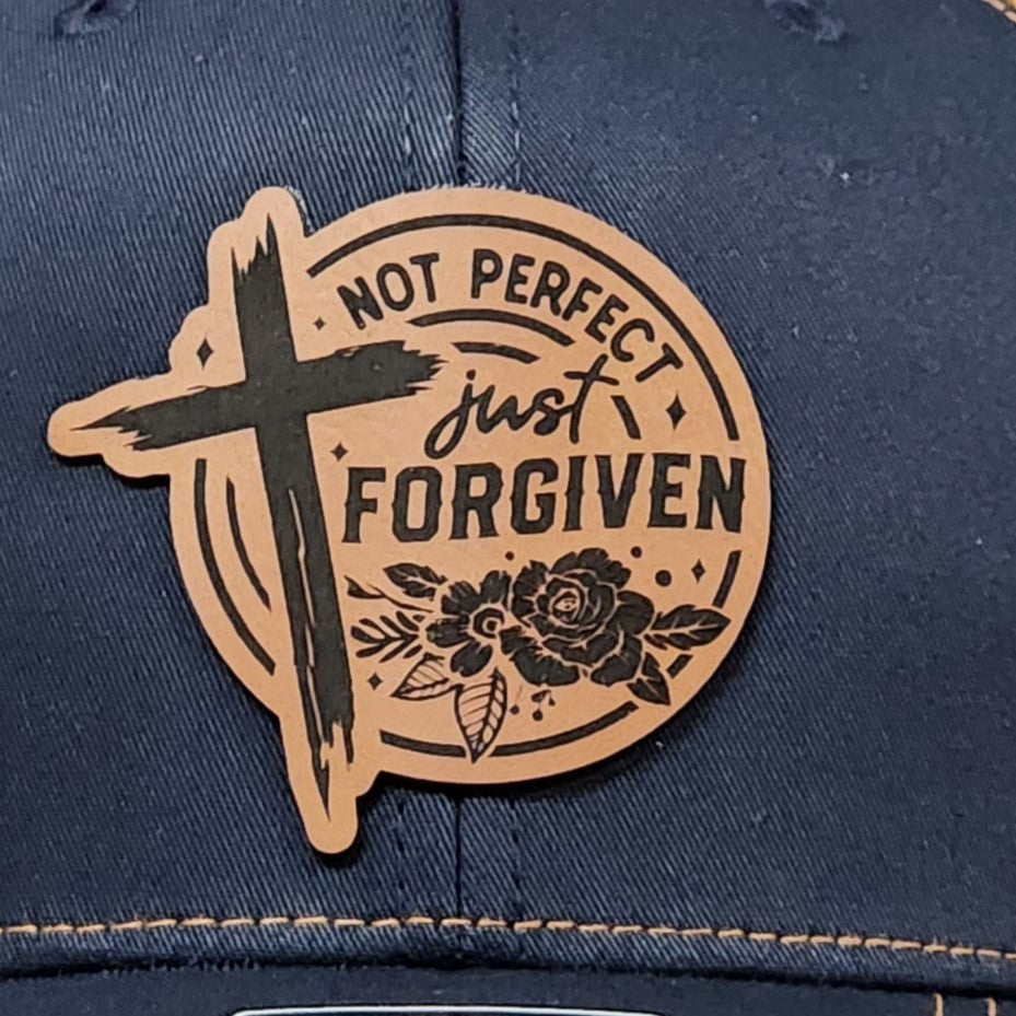 Christian leatherette hat patch with 'Not Perfect Just Forgiven' and cross design, perfect for faith-themed apparel.