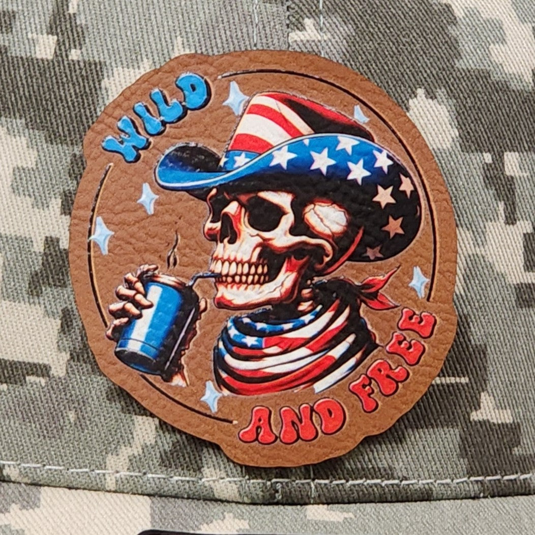 Wild and Free leatherette hat patch featuring a patriotic skull in a cowboy hat sipping a drink with vibrant colors.