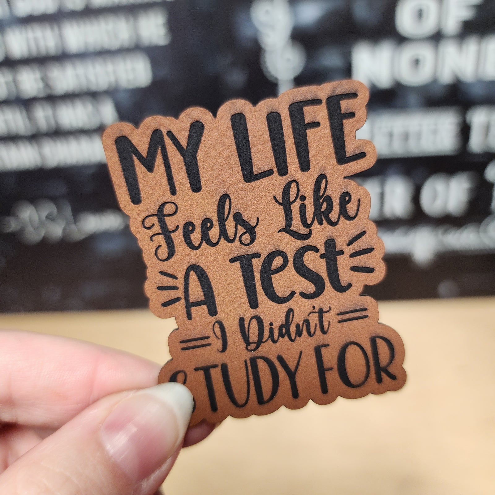 My Life Feels Like A Test leatherette hat patch, perfect for humorous accessories and gifts.