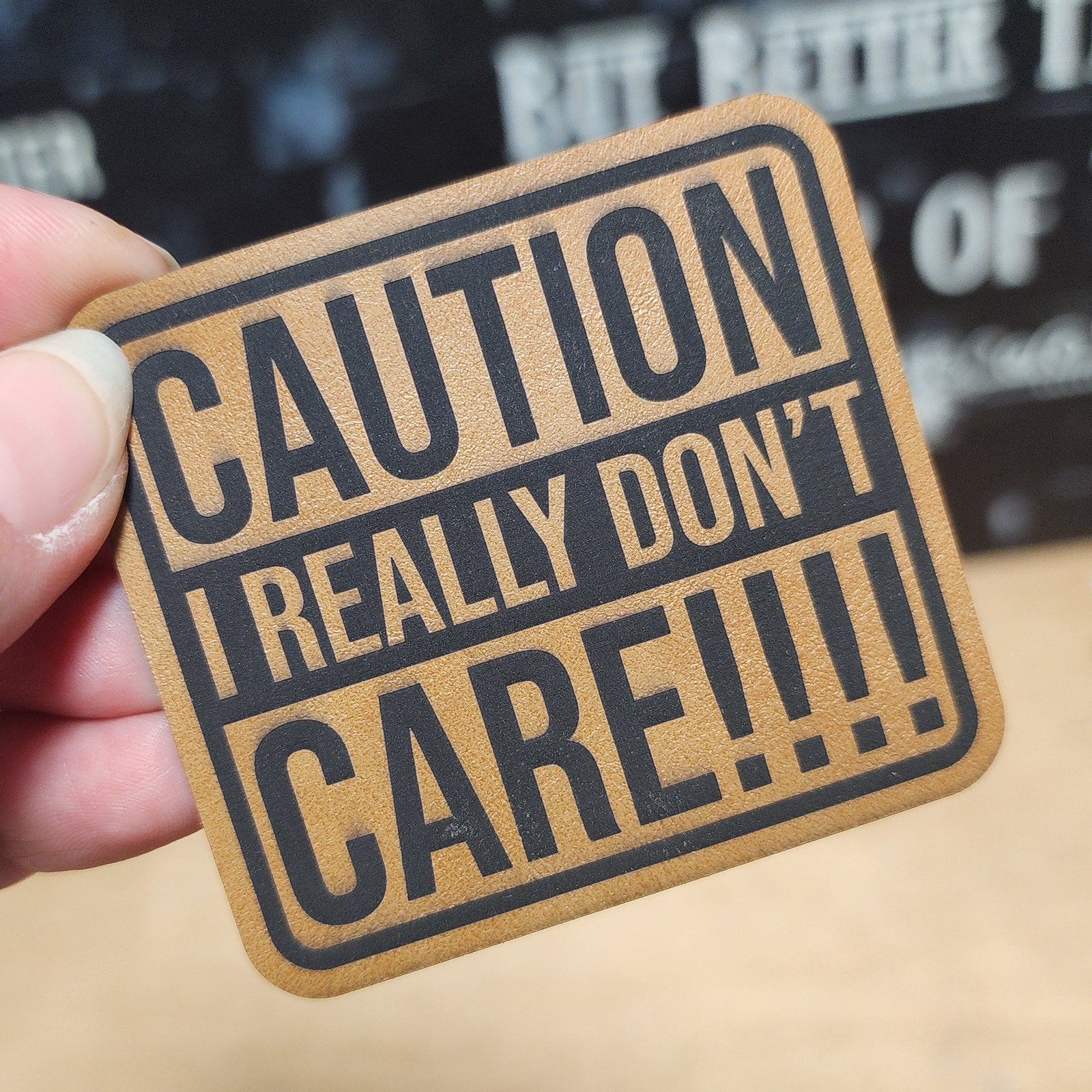 Caution I Really Don't Care leatherette hat patch for a bold statement piece on caps or jackets.