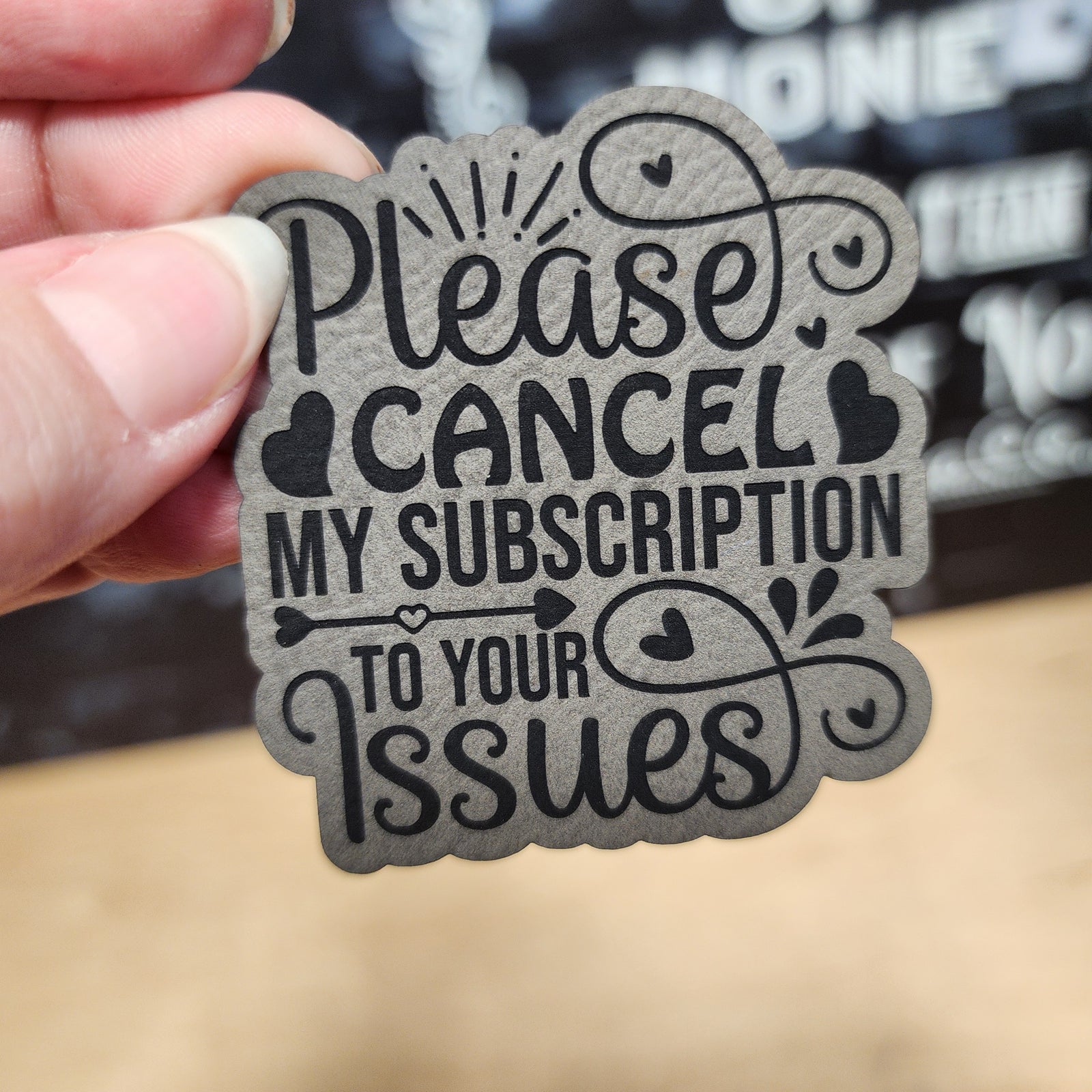 Leatherette hat patch saying 'Please Cancel My Subscription to Your Issues' perfect for quirky fashion lovers.