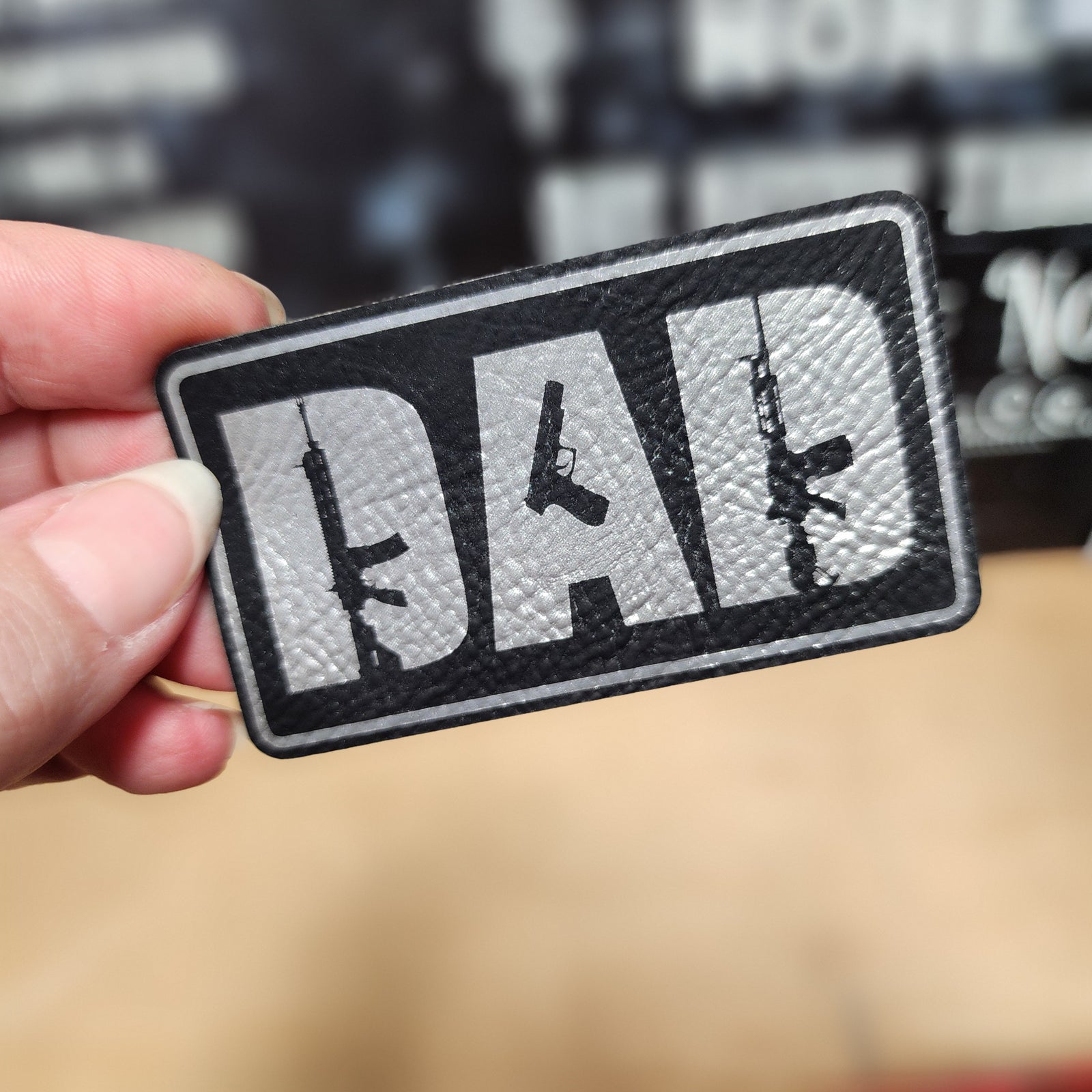 Dad leatherette patch with guns design, perfect for Father's Day gifts and tactical hat accessories for proud dads.