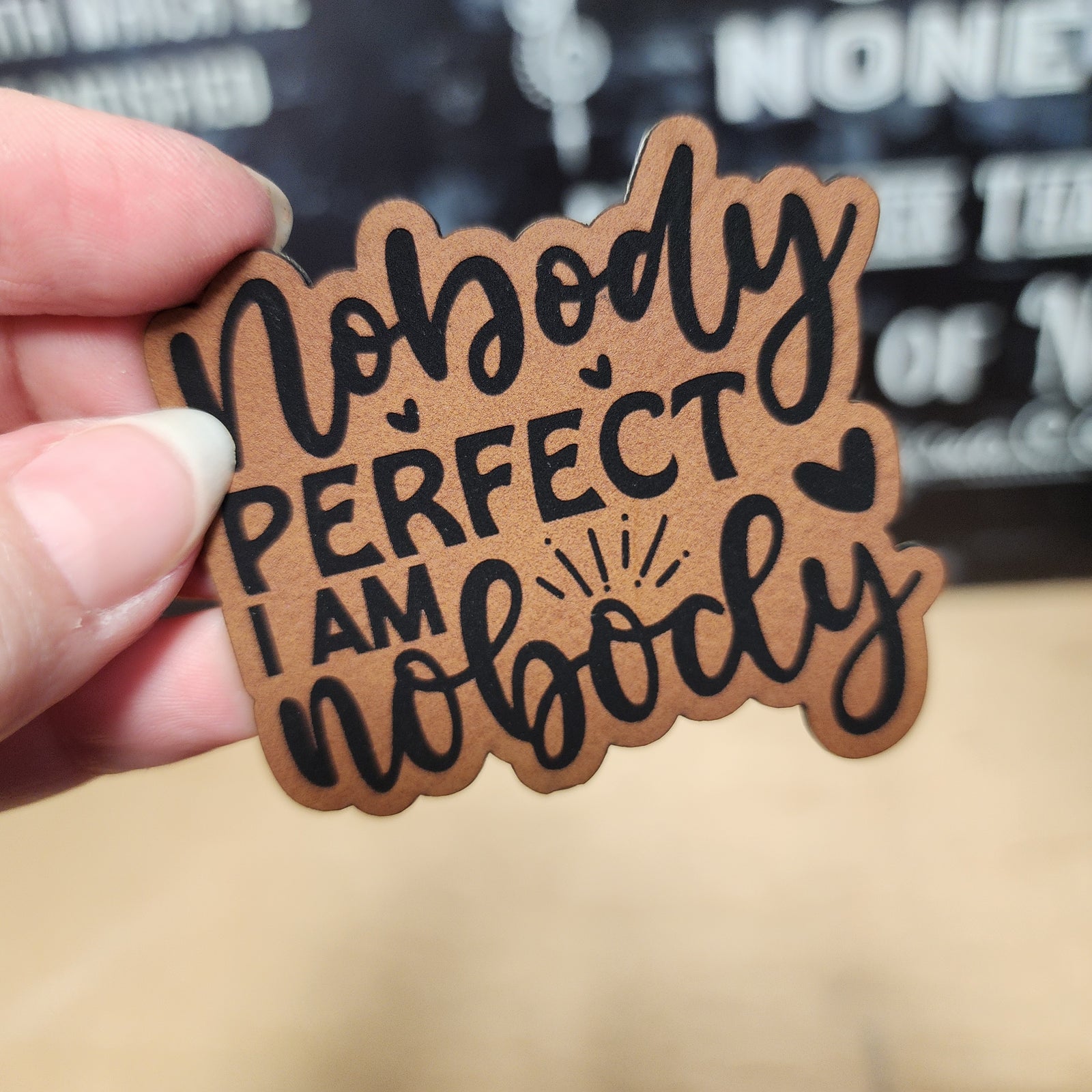 Nobody Perfect leatherette hat patch, perfect for casual wear and unique fashion statements.