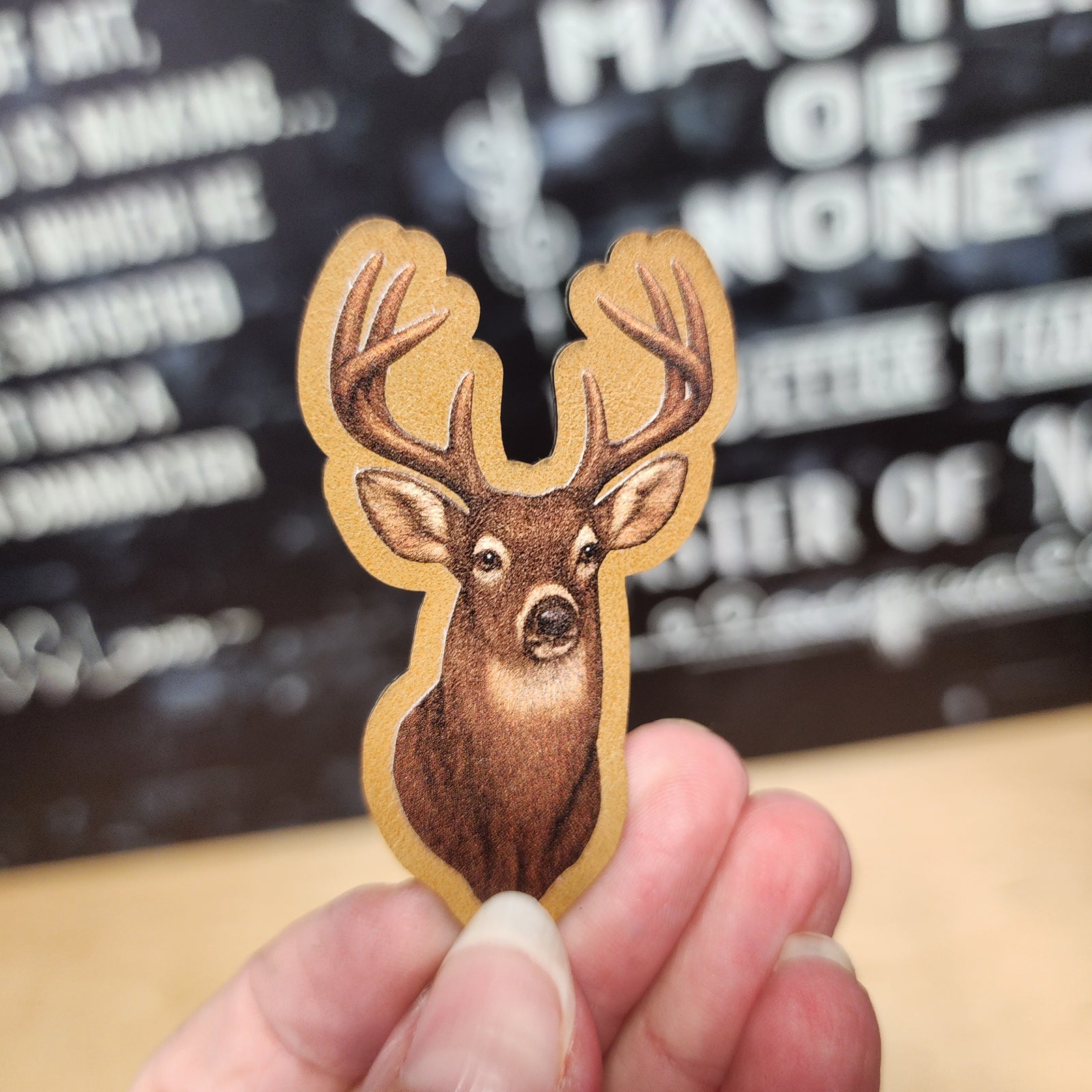 Leatherette hat patch featuring a realistic deer head design, perfect for outdoor enthusiasts and hunting apparel.