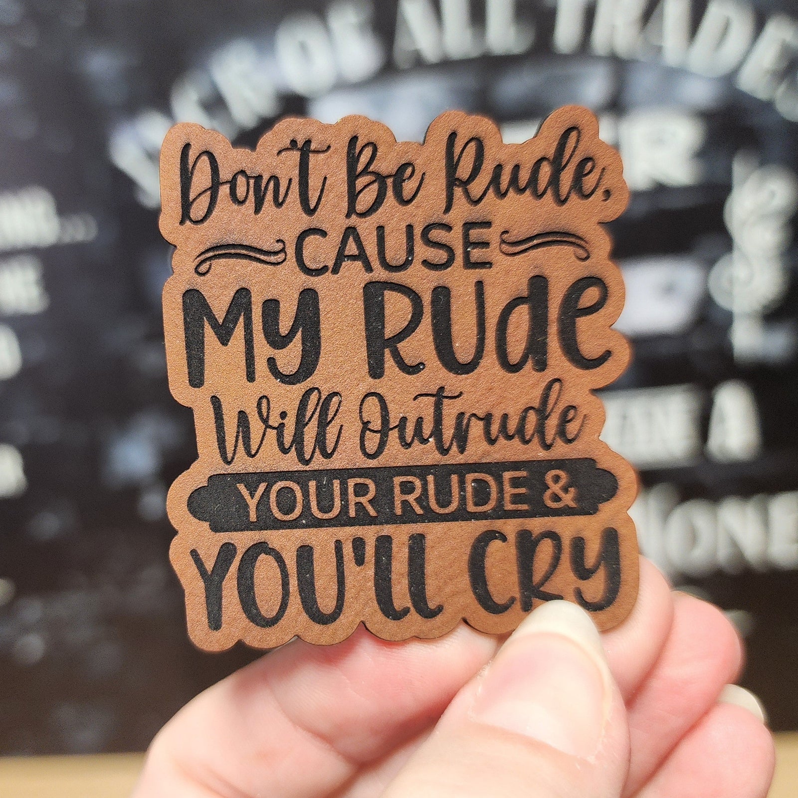 Funny leatherette hat patch with 'Don't Be Rude, Cause My Rude Will Outrude Your Rude & You'll Cry' saying.