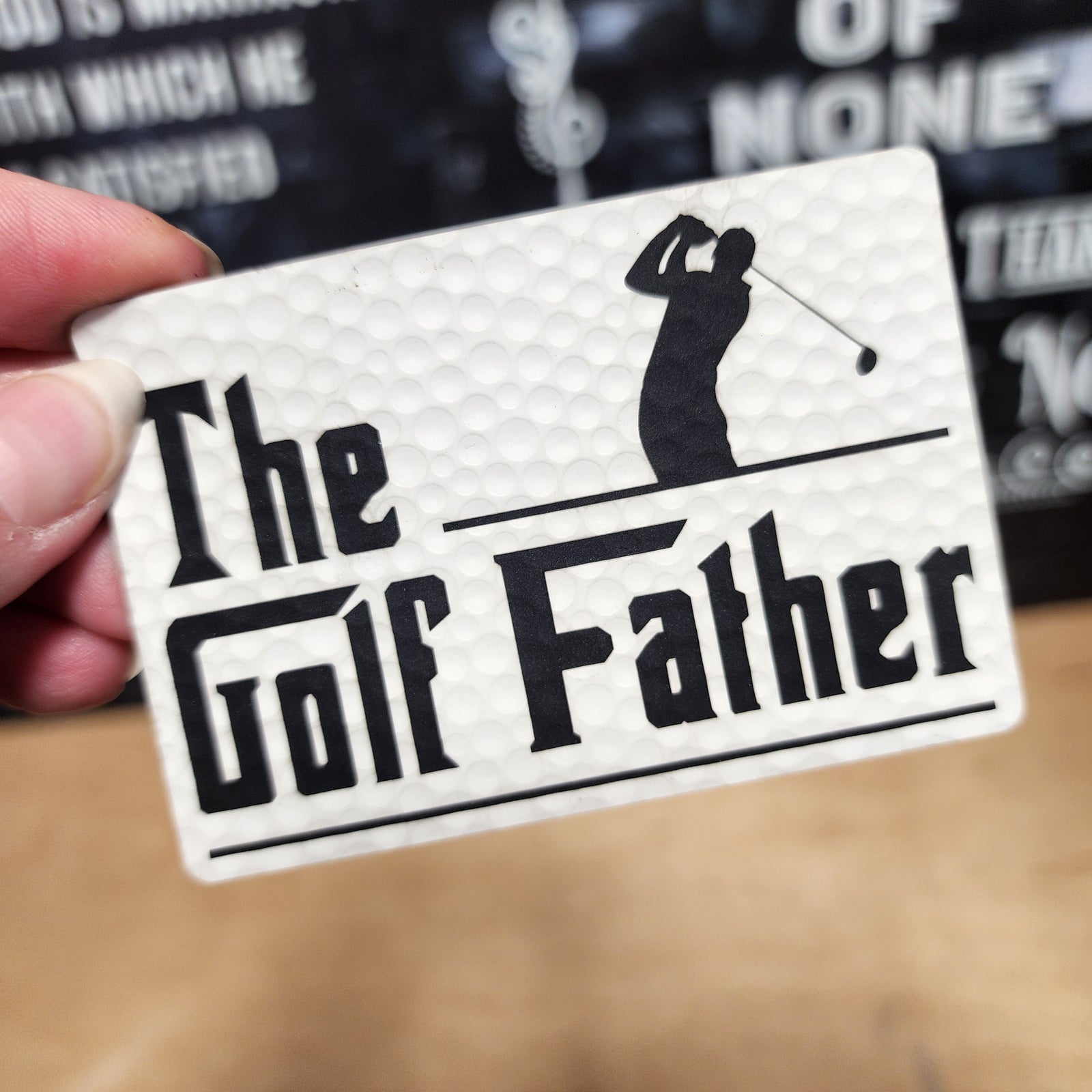 The Golf Father leatherette hat patch, perfect for golf enthusiasts and stylish headwear accessories.