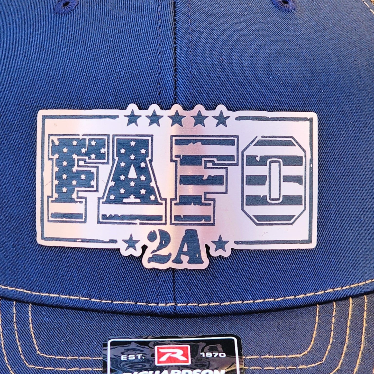 FAFO 2A leatherette hat patch on a blue cap, perfect for patriotic and Second Amendment enthusiasts.