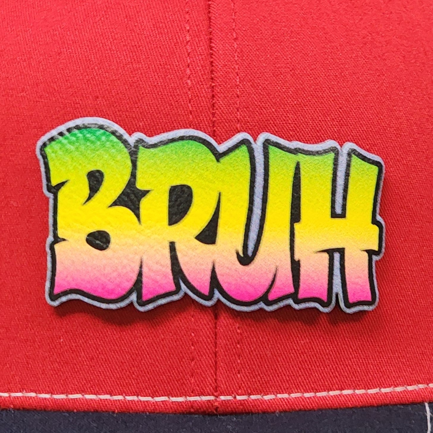 Colorful BRUH leatherette hat patch for trendy caps, perfect for streetwear and casual fashion enthusiasts.
