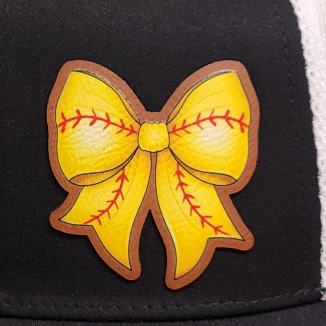 Yellow leatherette bow hat patch with red stitching, perfect for sports fans and fashion enthusiasts.