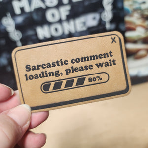 Sarcastic comment loading leatherette hat patch for witty hat lovers and humor enthusiasts.