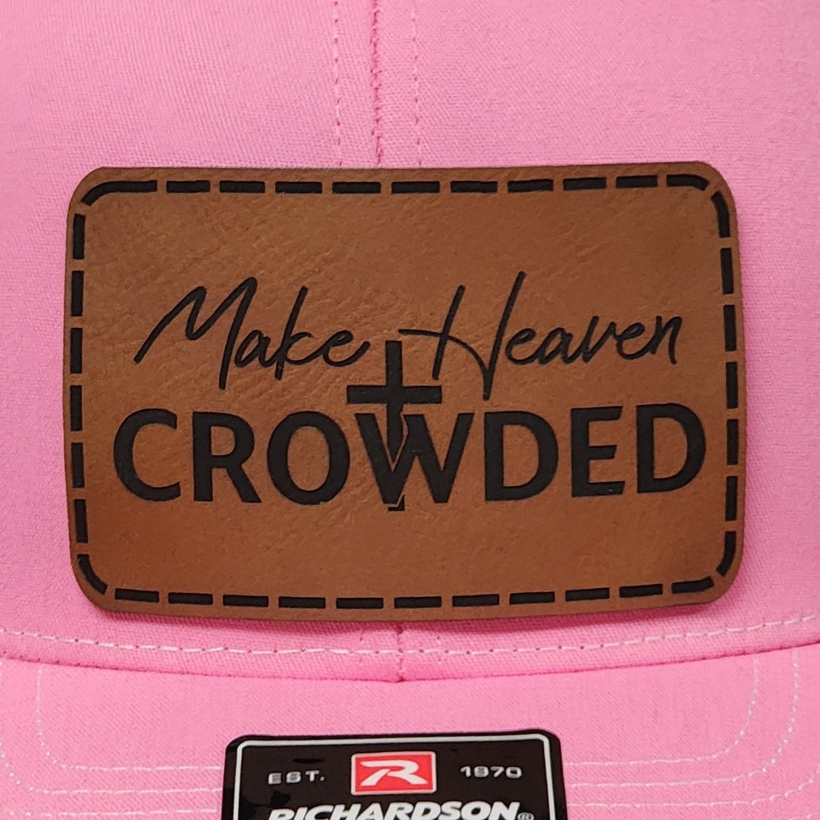 Pink baseball cap with leatherette patch reading 'Make Heaven Crowded,' perfect for Christian apparel enthusiasts.