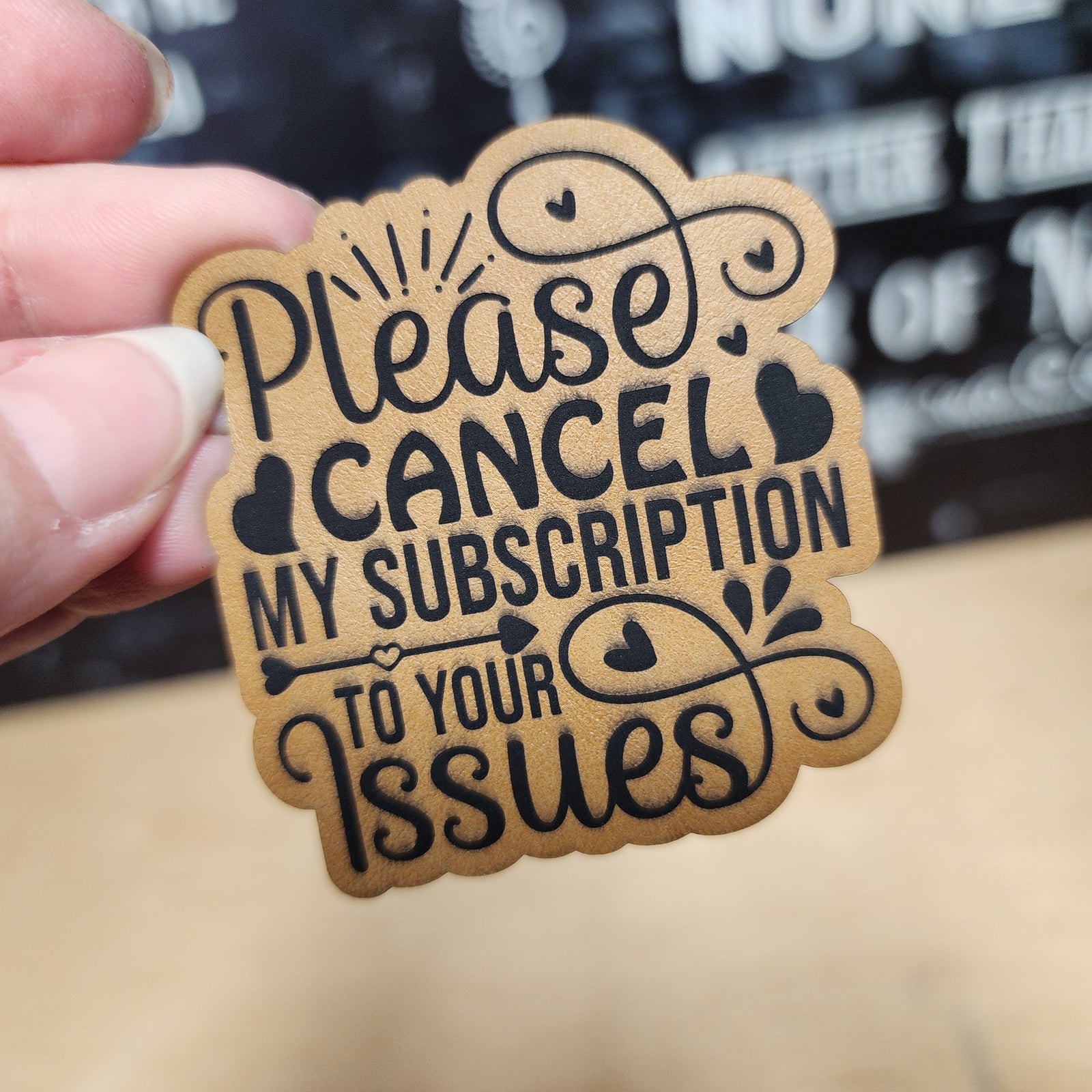 Funny leatherette hat patch: 'Please Cancel My Subscription to Your Issues', perfect for quirky gifts and accessories.