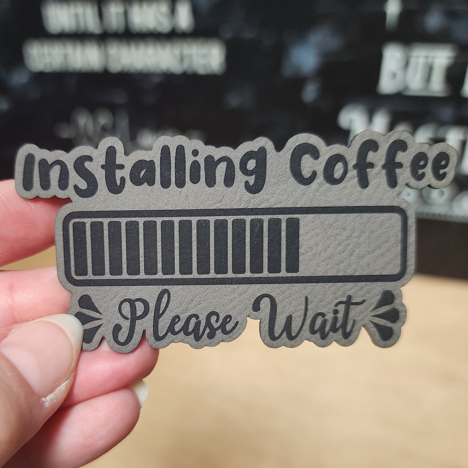Installing Coffee leatherette hat patch with progress bar design, perfect for coffee lovers and unique gifts.