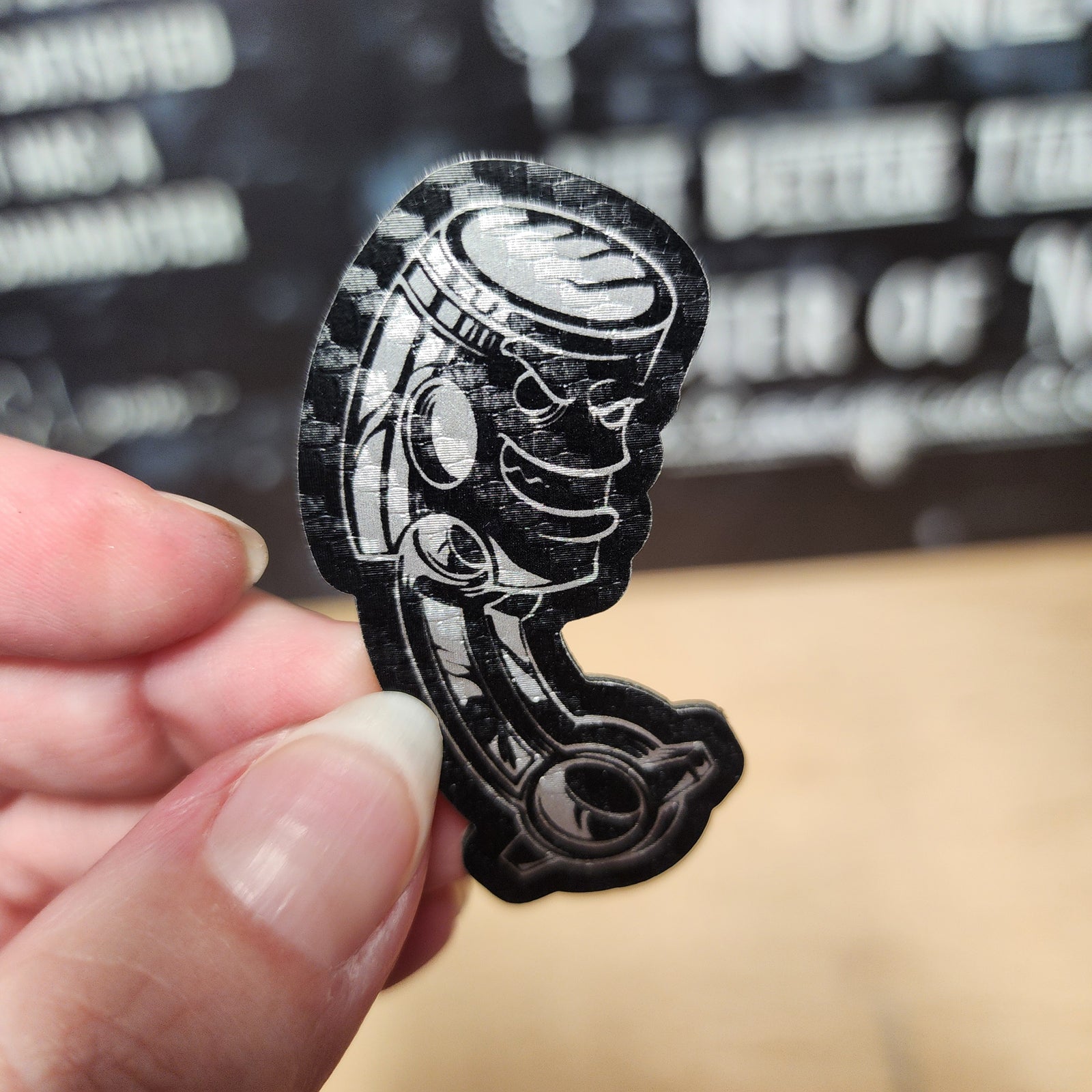 Leatherette hat patch featuring a stylish piston design, perfect for automotive enthusiasts and unique accessories.