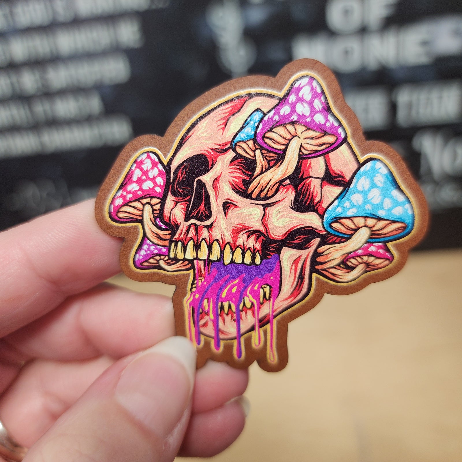 Psychedelic skull and mushroom leatherette hat patch, vibrant colors perfect for alternative fashion or festival gear.