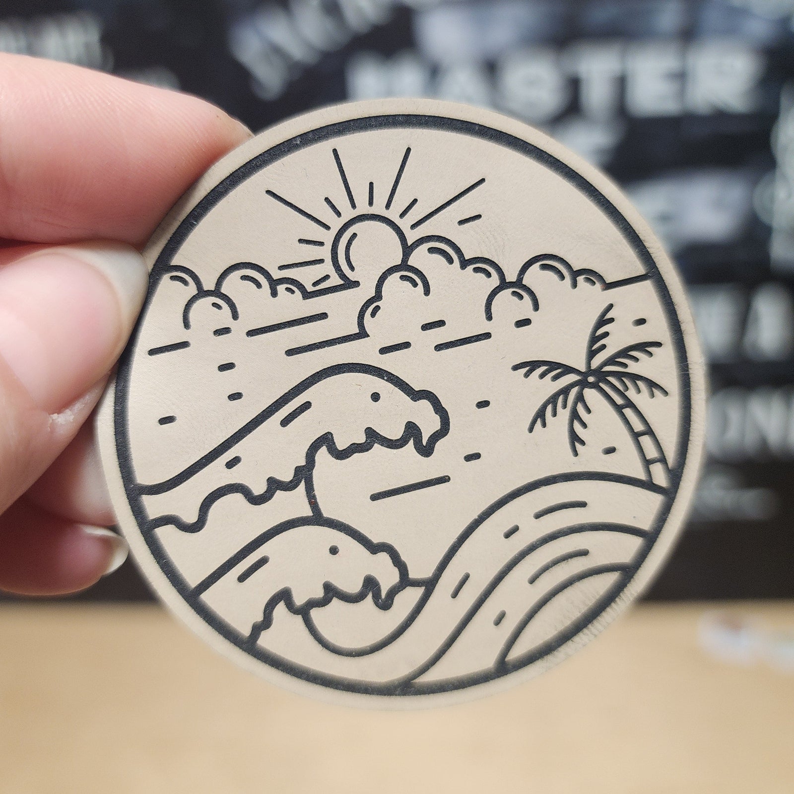 Beach wave leatherette hat patch featuring sunrise, clouds, and palm trees for outdoor adventures.