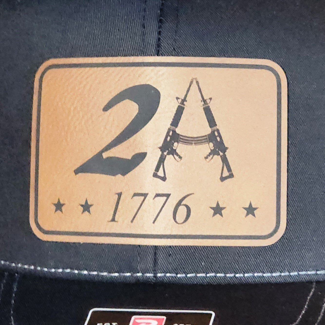 2A leatherette hat patch featuring rifles and stars, perfect for Second Amendment supporters and patriotic wear.