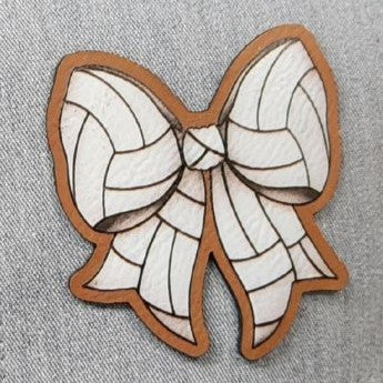 Leatherette bow patch for hats, stylish decorative accessory for fashion enthusiasts and customizable cap designs.
