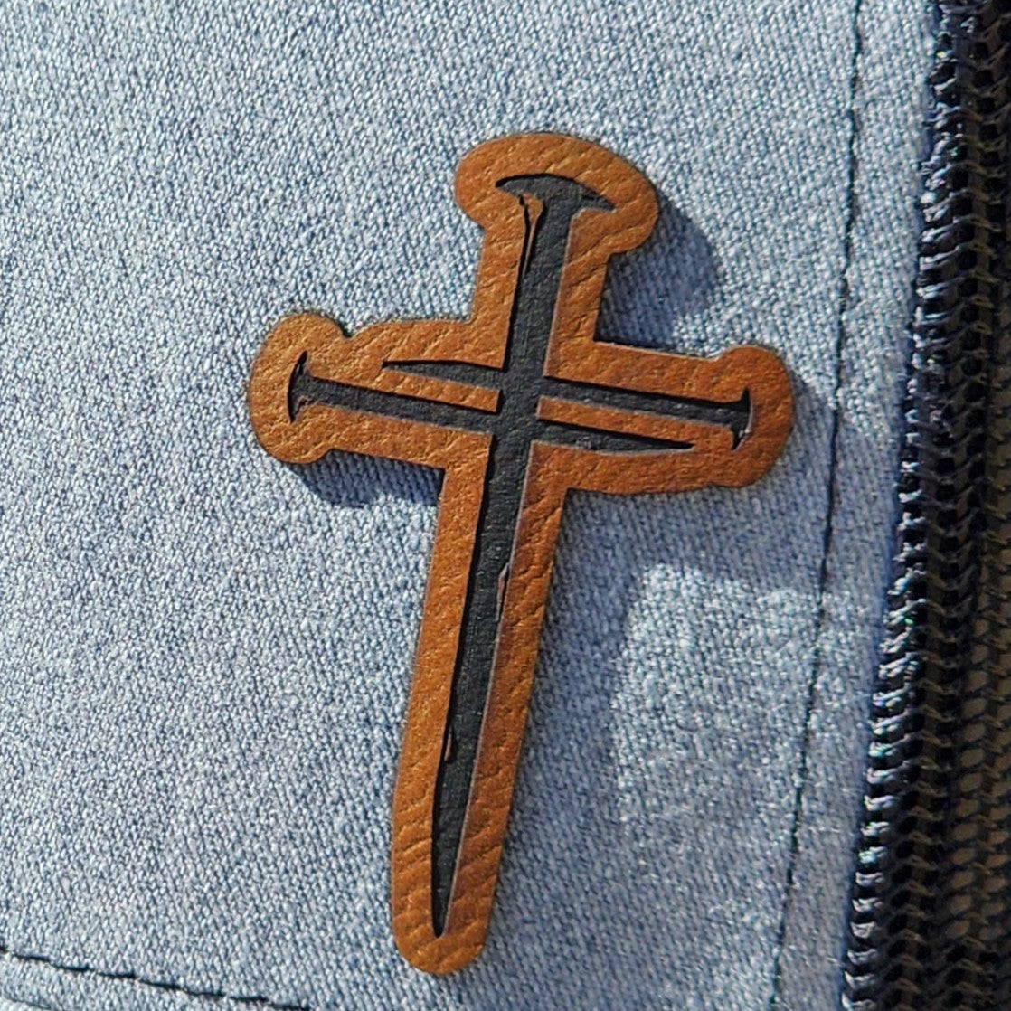 Cross leatherette hat patch, stylish Christian accessory for hats and bags, perfect for faith-based fashion.