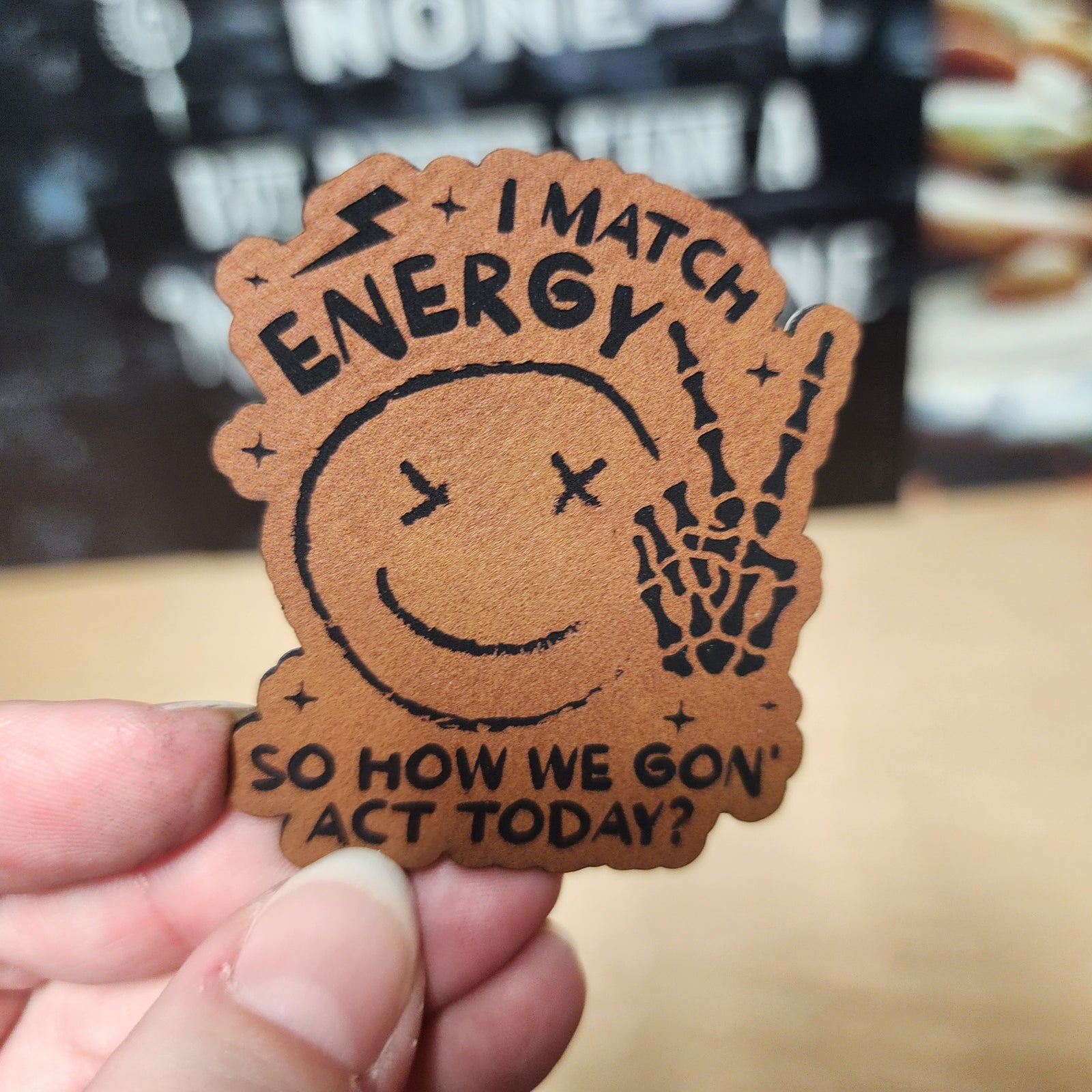 Leatherette hat patch featuring a smiling face with the phrase 'I Match Energy' for fun clothing accessories.