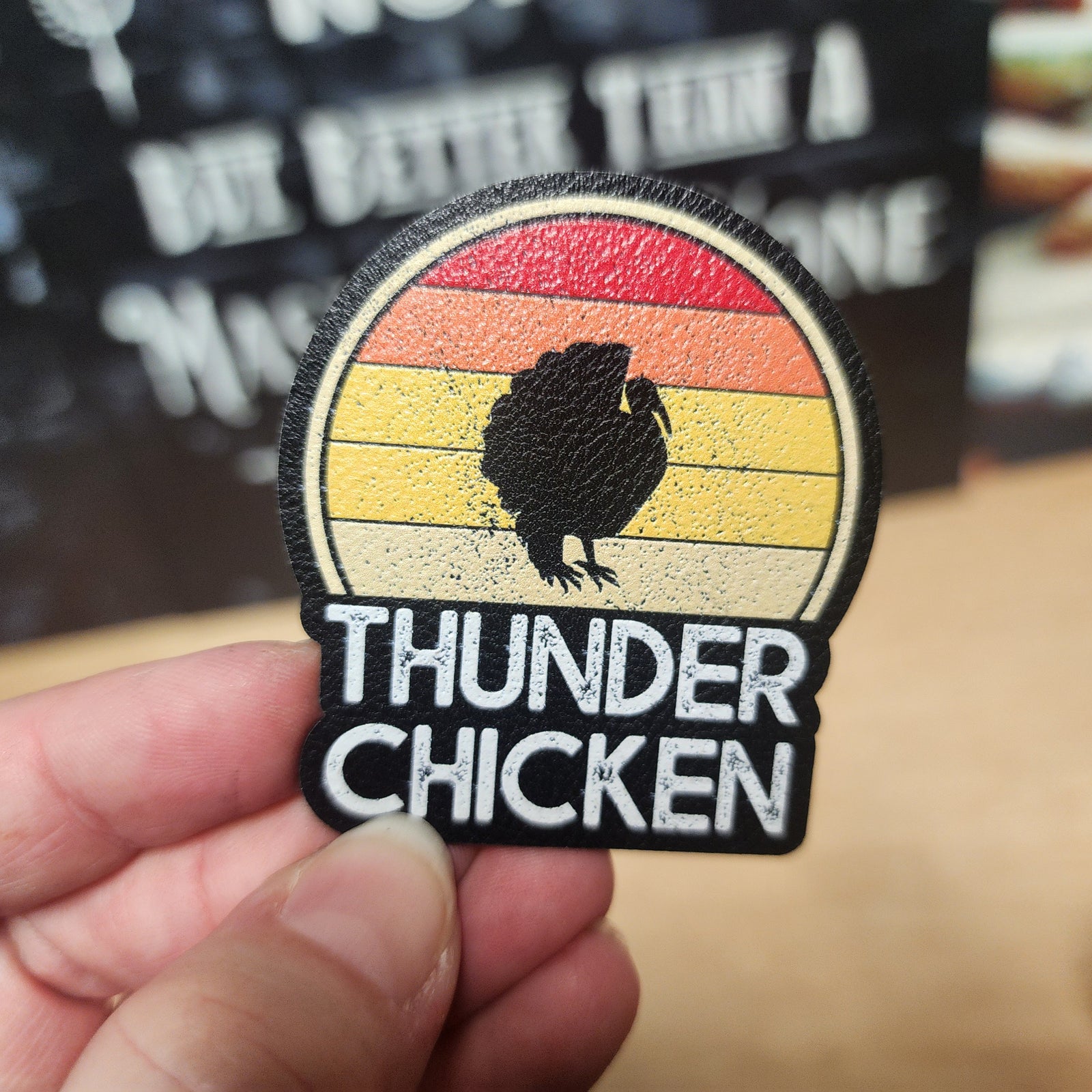 Thunder Chicken leatherette hat patch with retro sunset design, perfect for stylish outdoor adventures.