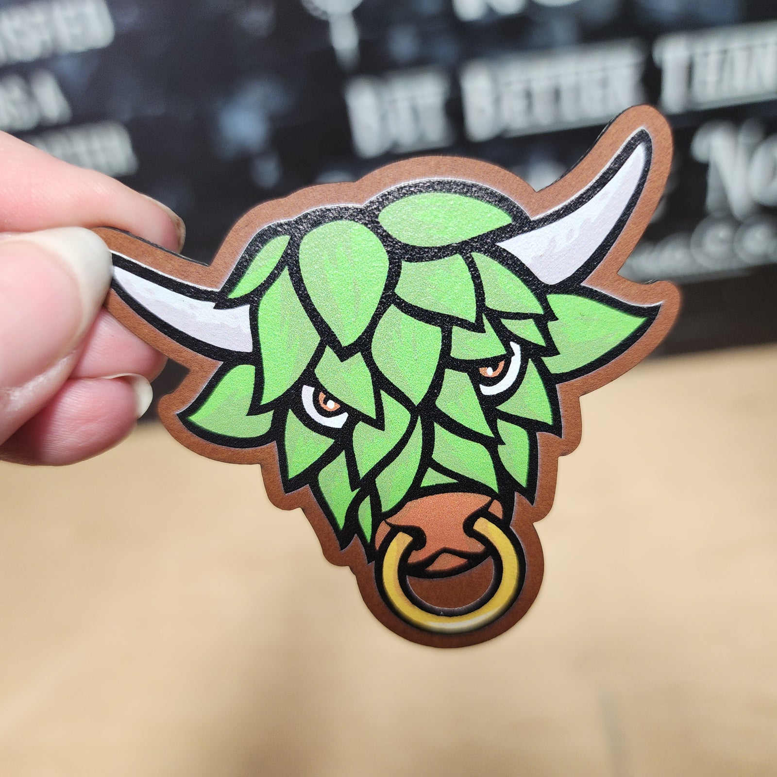 Whimsical leatherette hat patch featuring a hop-themed bull design, perfect for craft beer lovers and brewing fans.
