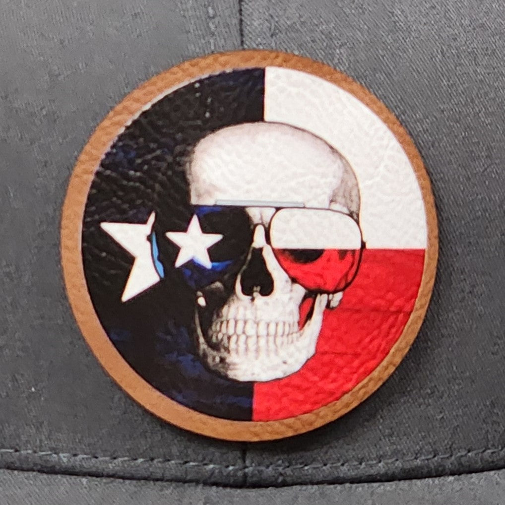 Unique Texas skull leatherette hat patch featuring a skull with sunglasses in red, white, and blue colors.